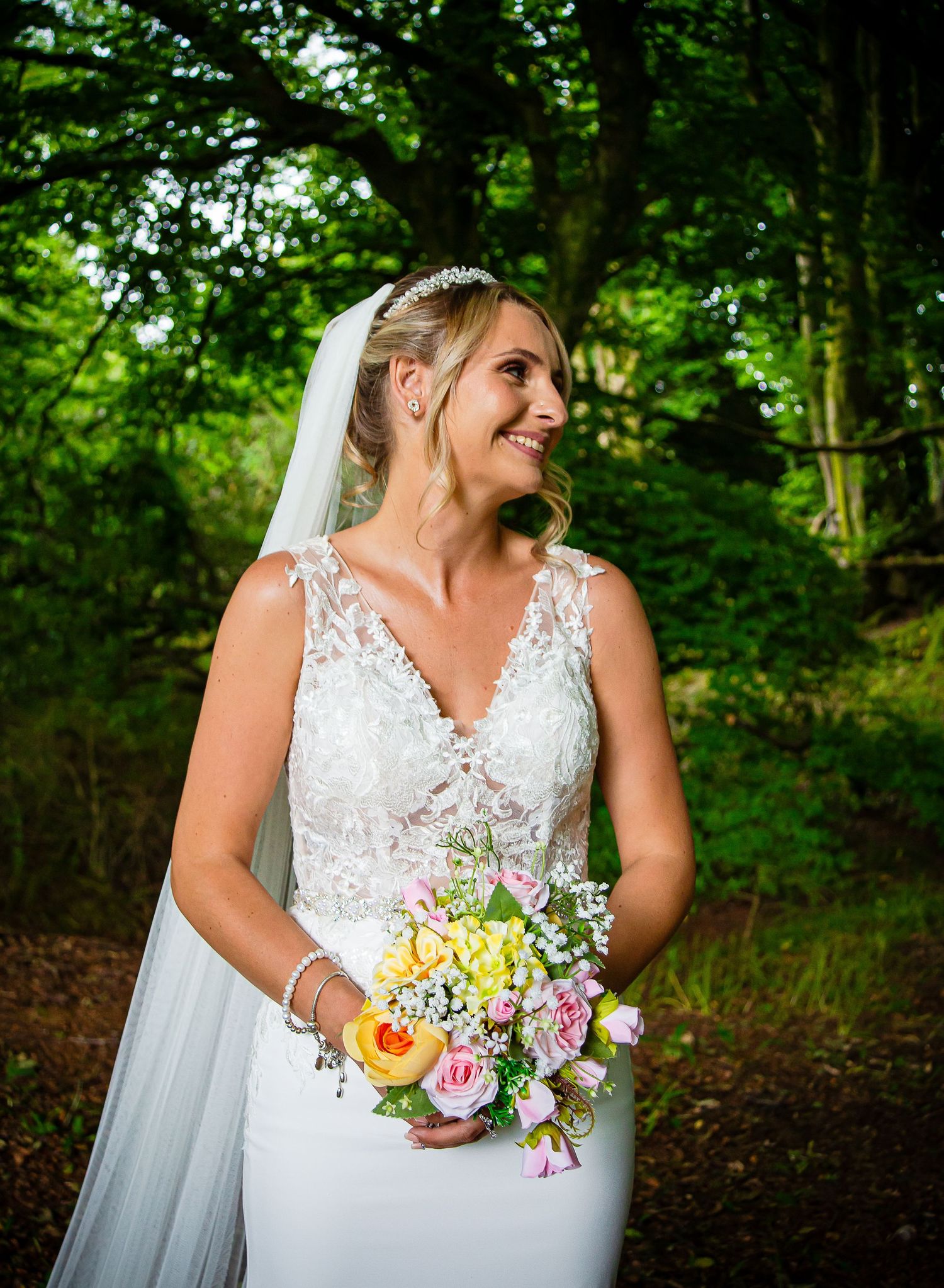 Natural bridal portrait with a colourful summer flower bouquet at Ridgeway Golf Club