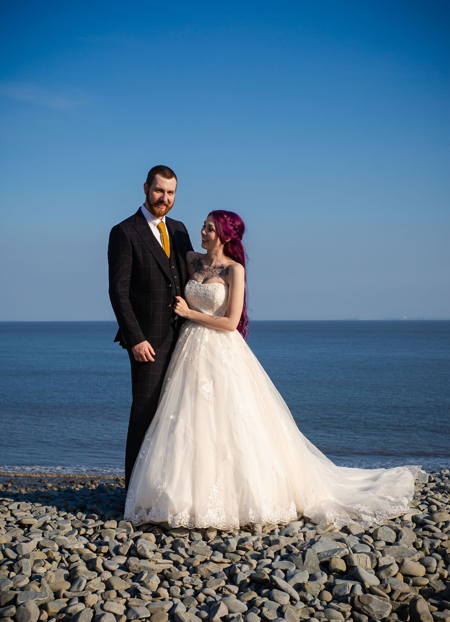 Bride and groom embracing on Porthkerry Beach