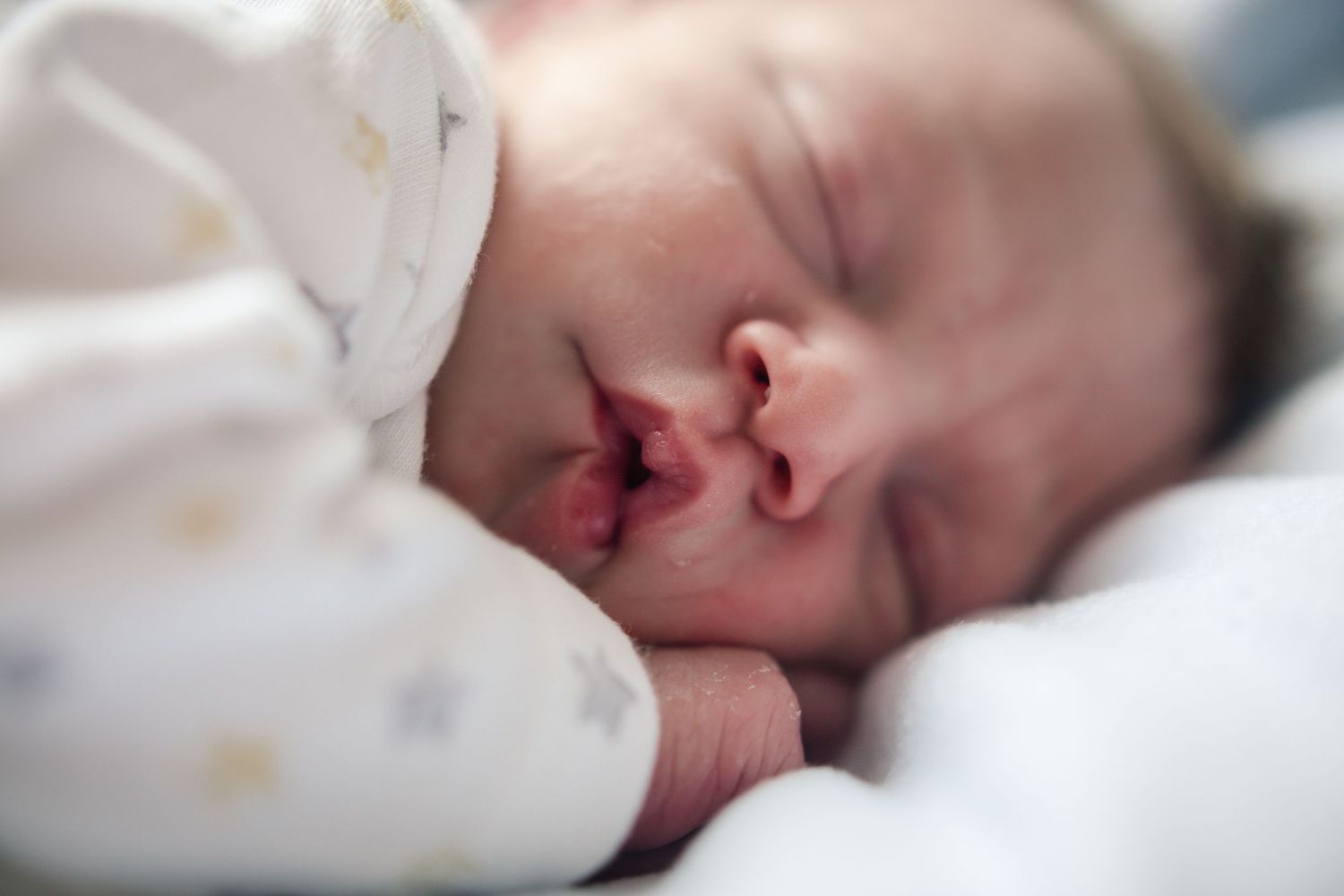 Close-up portrait of a peacefully sleeping newborn baby