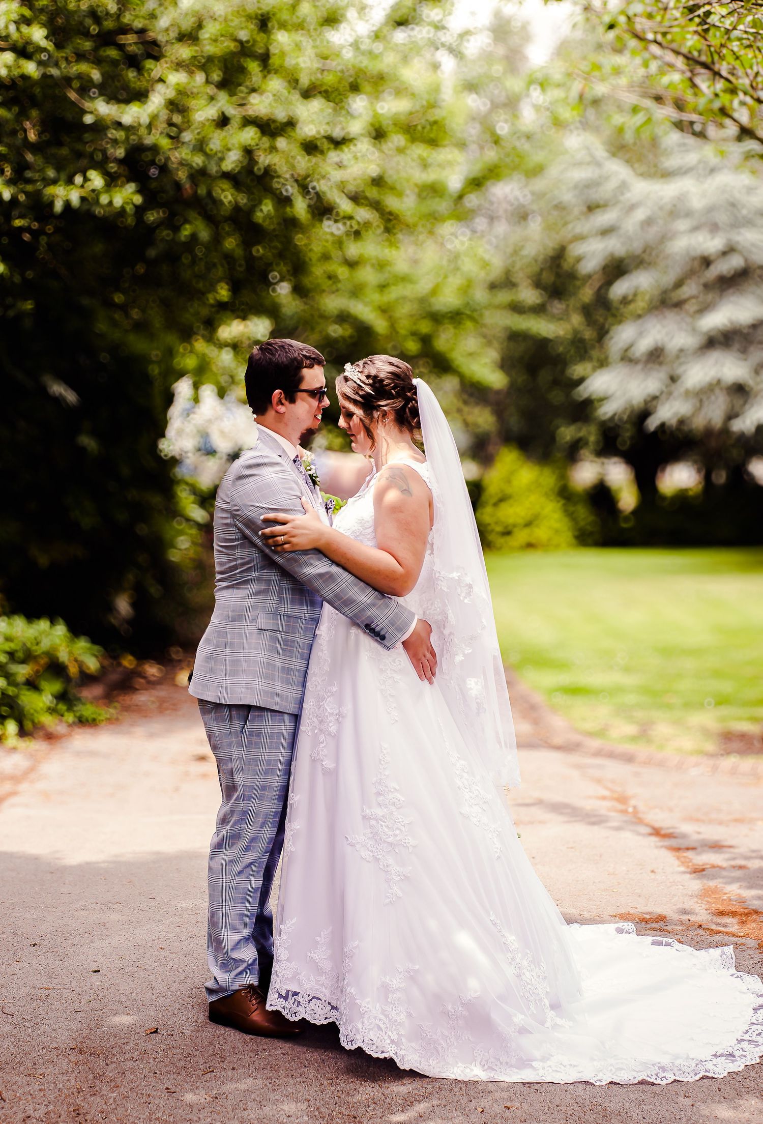 Bride and groom sharing an embrace in the gardens