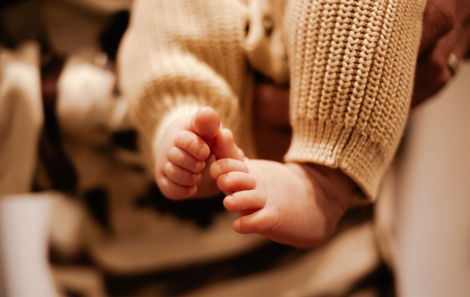 Close-up of a newborn baby’s tiny feet during a relaxed lifestyle session