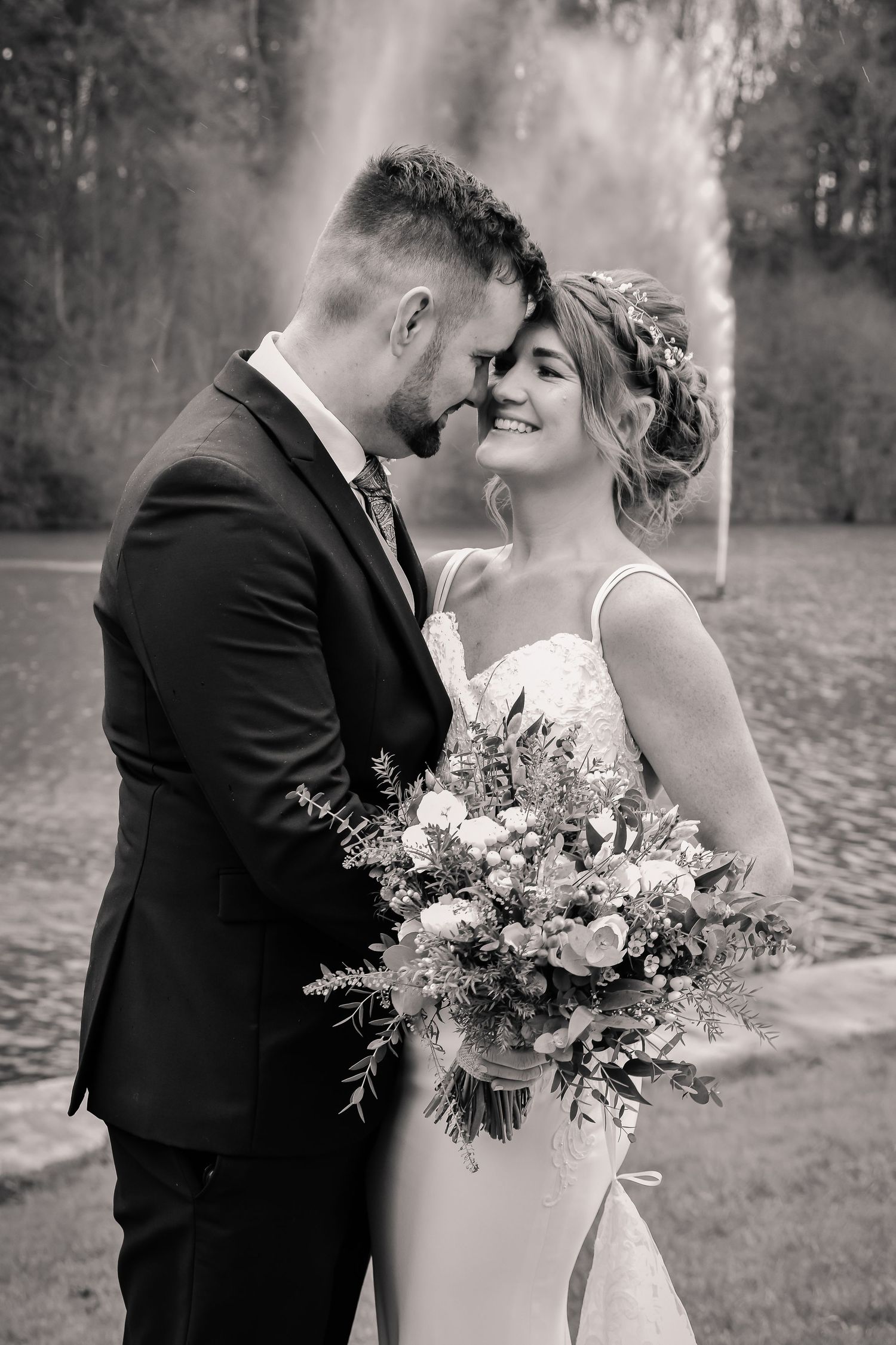 Black and white portrait of newlyweds kissing at Canada Lodge, Cardiff