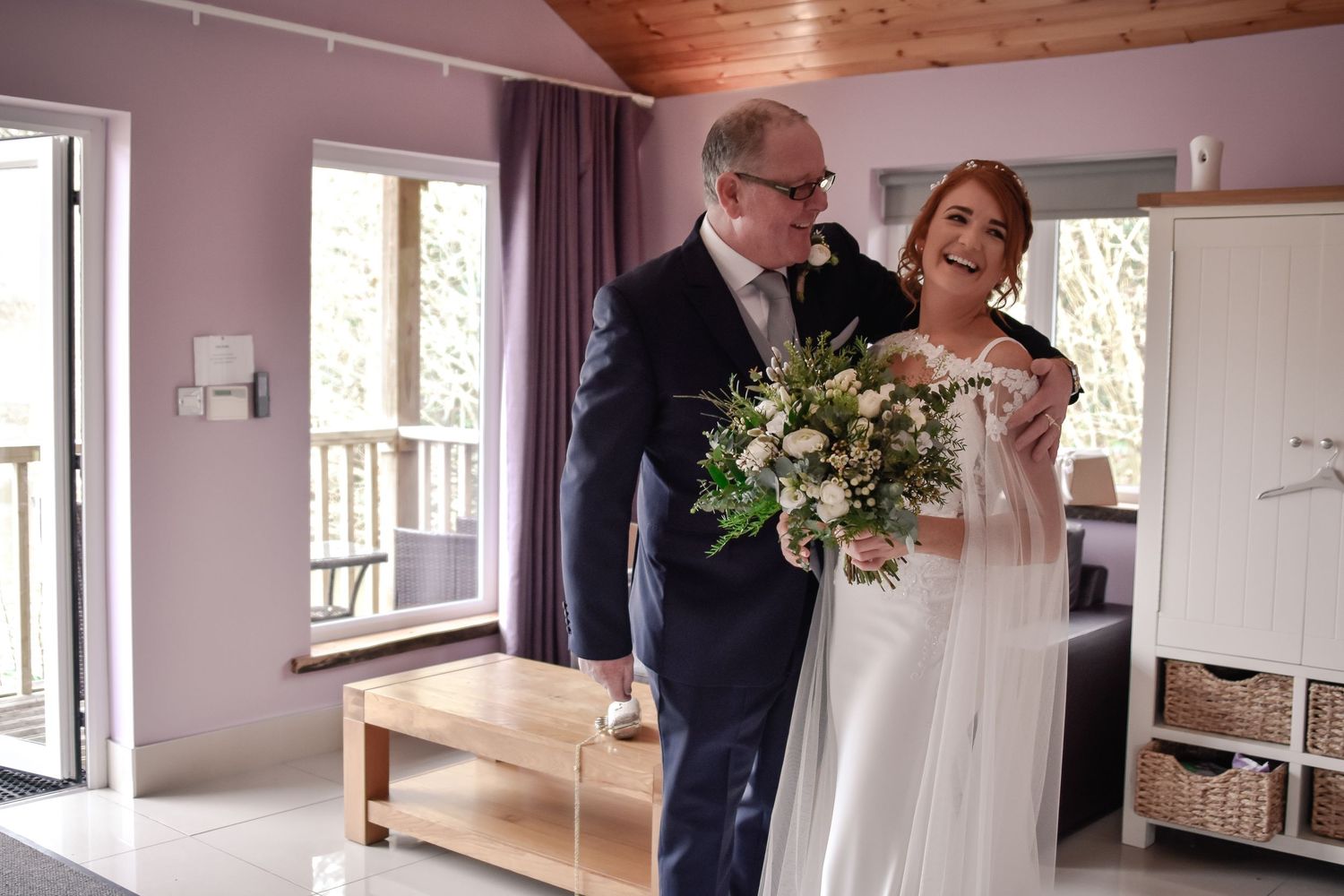 Bride sharing an emotional moment with her father before the ceremony