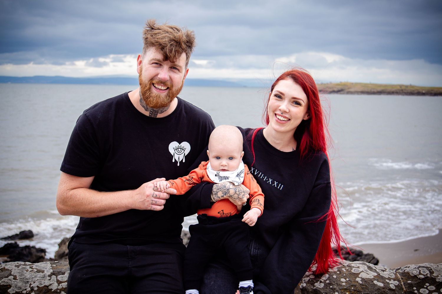 Family of three smiling together beside the sea at Barry Island
Rosedew Farm family session