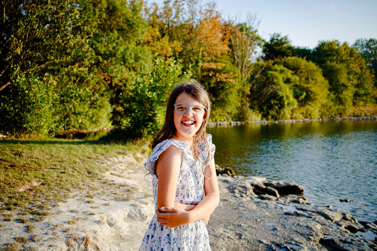 Natural outdoor portrait of a girl beside a peaceful South Wales lake