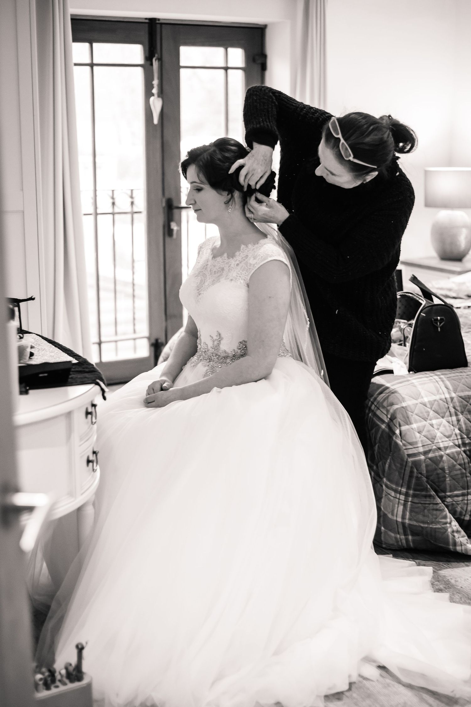 Bride having her hair styled before her Craig y Nos Castle wedding