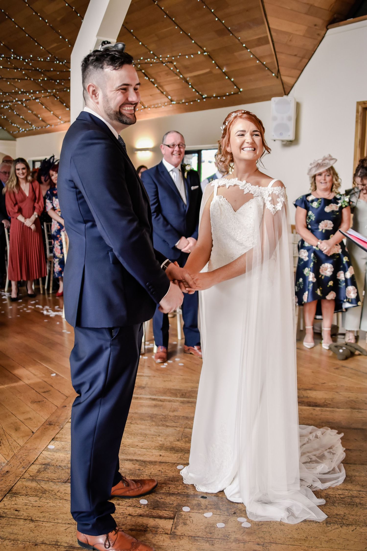 Bride and groom smiling together during their Canada Lodge wedding ceremony