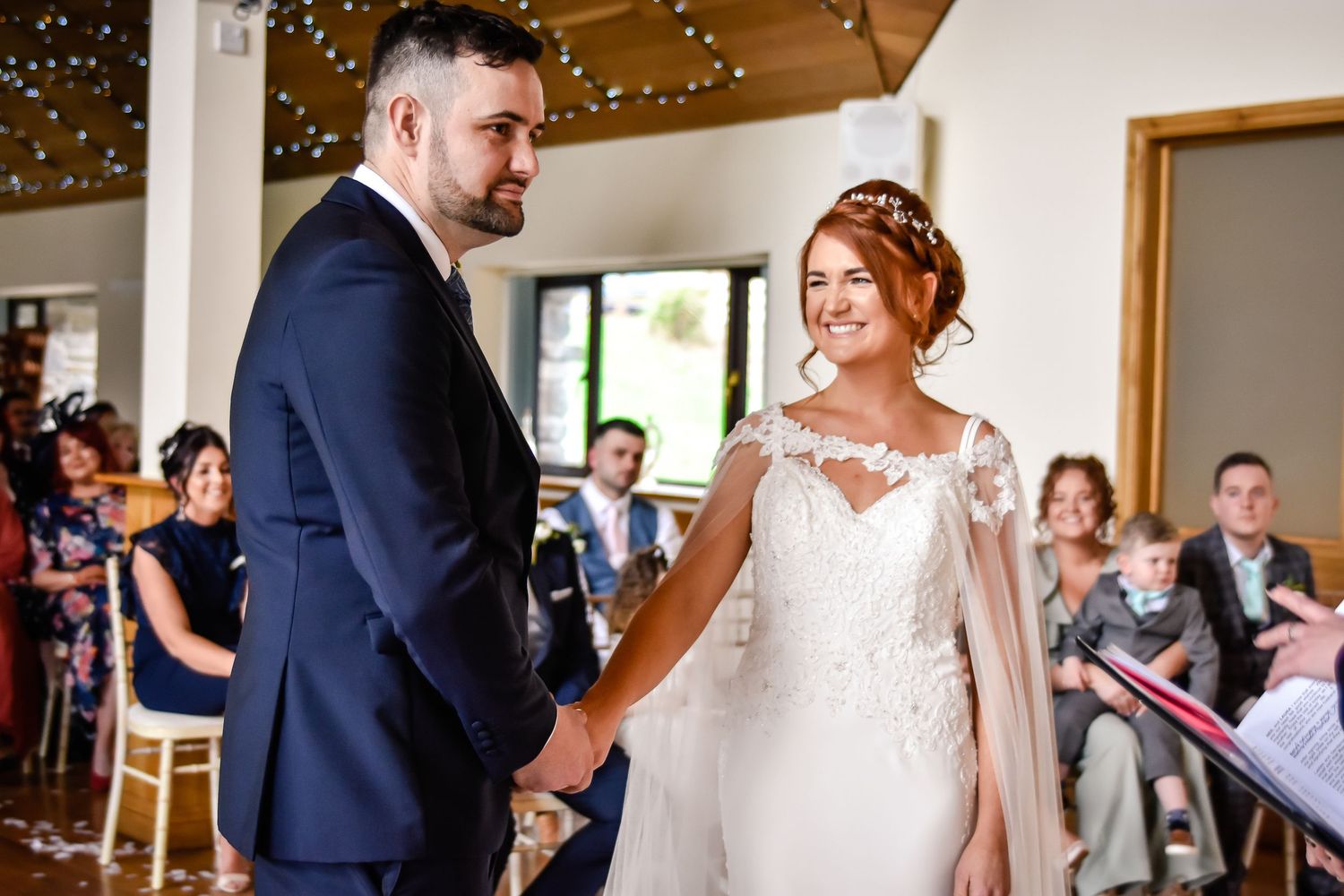 Bride smiling at her groom during their Canada Lodge ceremony in Cardiff