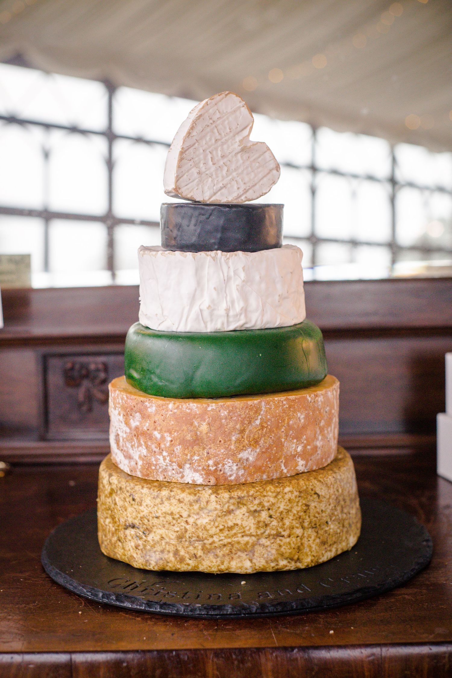 Colourful three-tier wedding cake displayed at Craig y Nos Castle