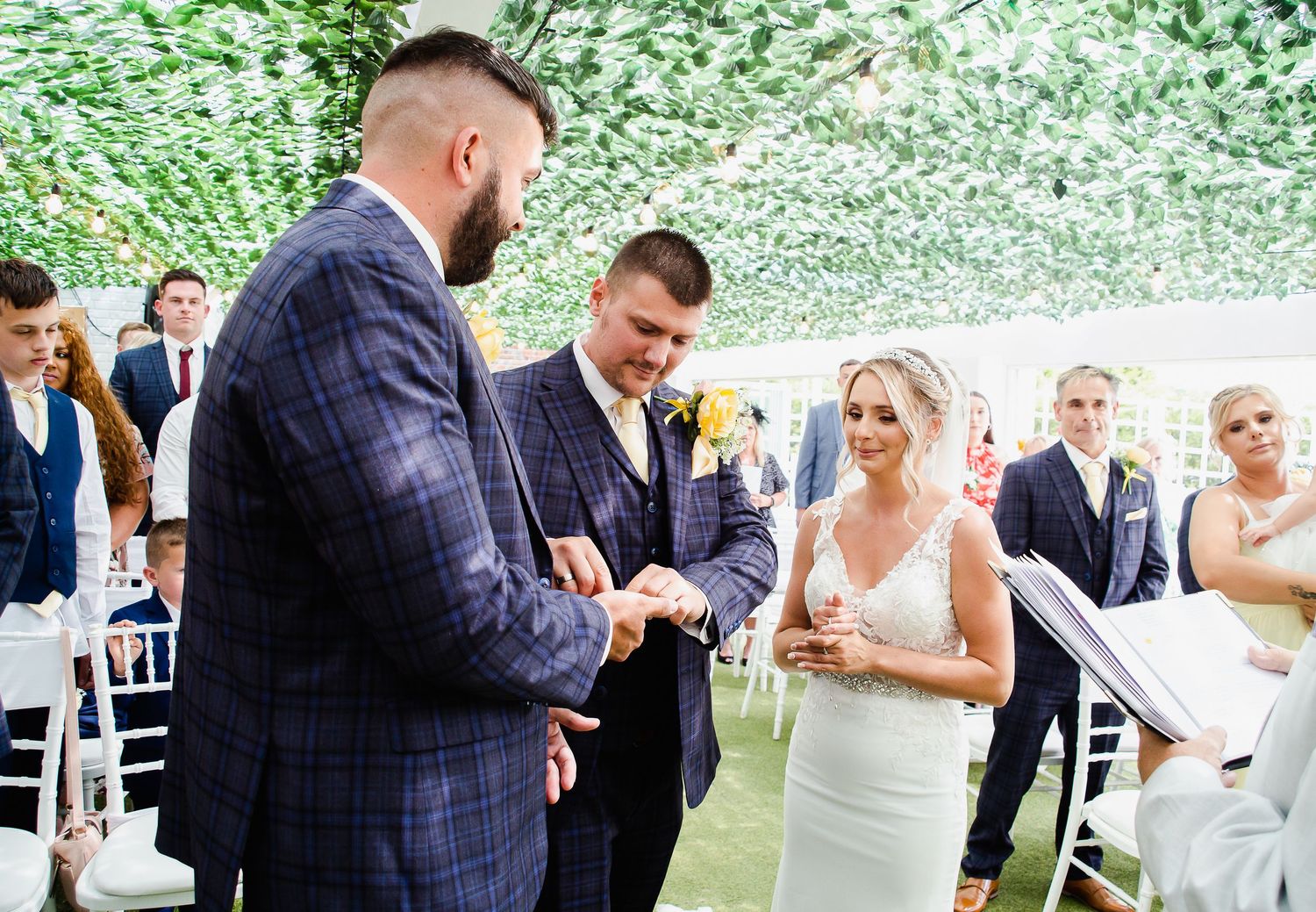 Best man presenting the wedding rings during the ceremony