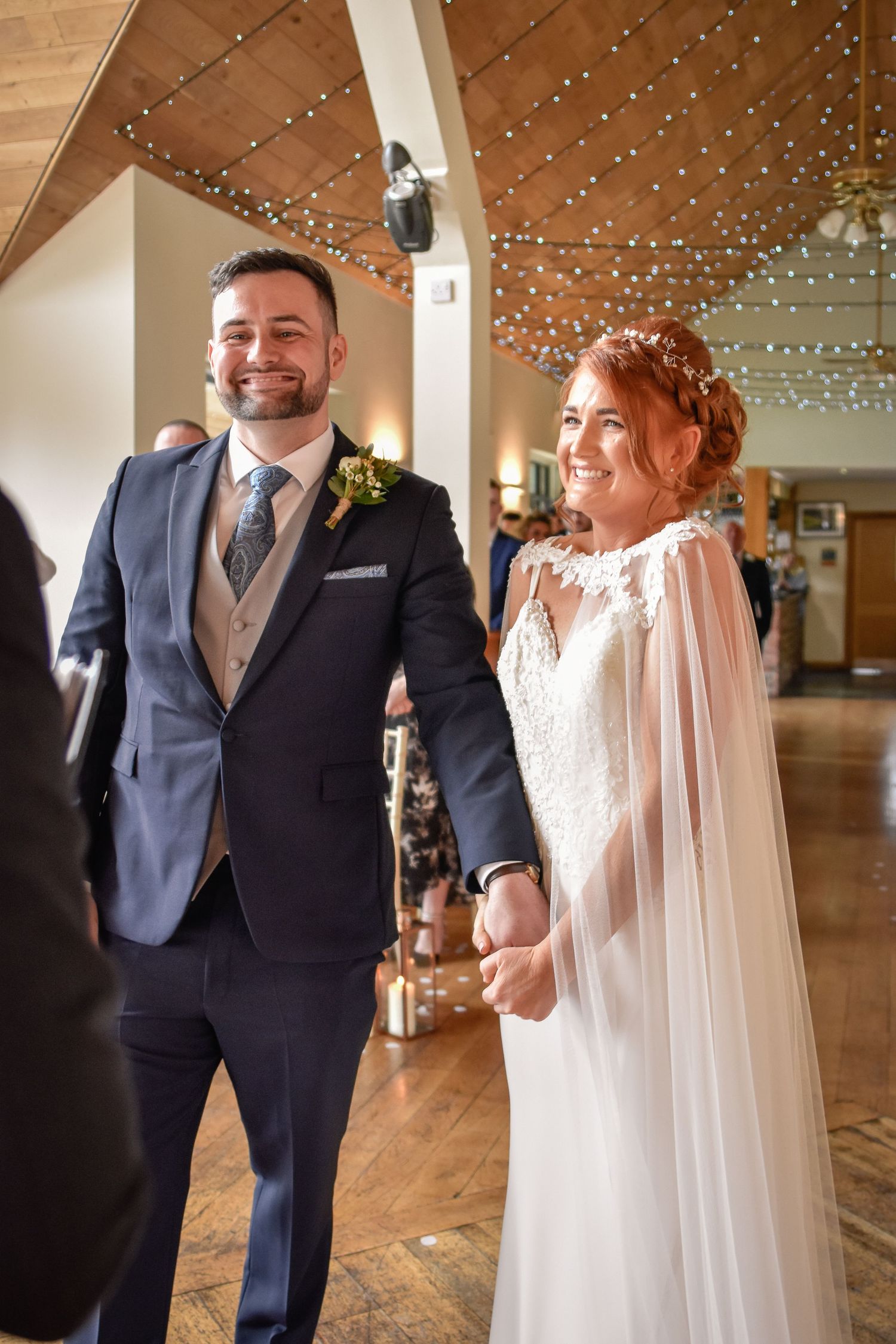 Newly married couple walking happily from their Canada Lodge ceremony