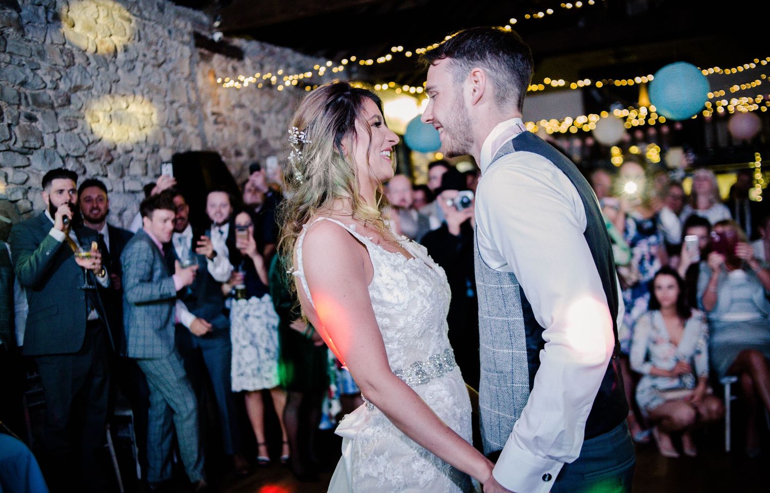 Newlywed couple sharing a kiss during their first dance