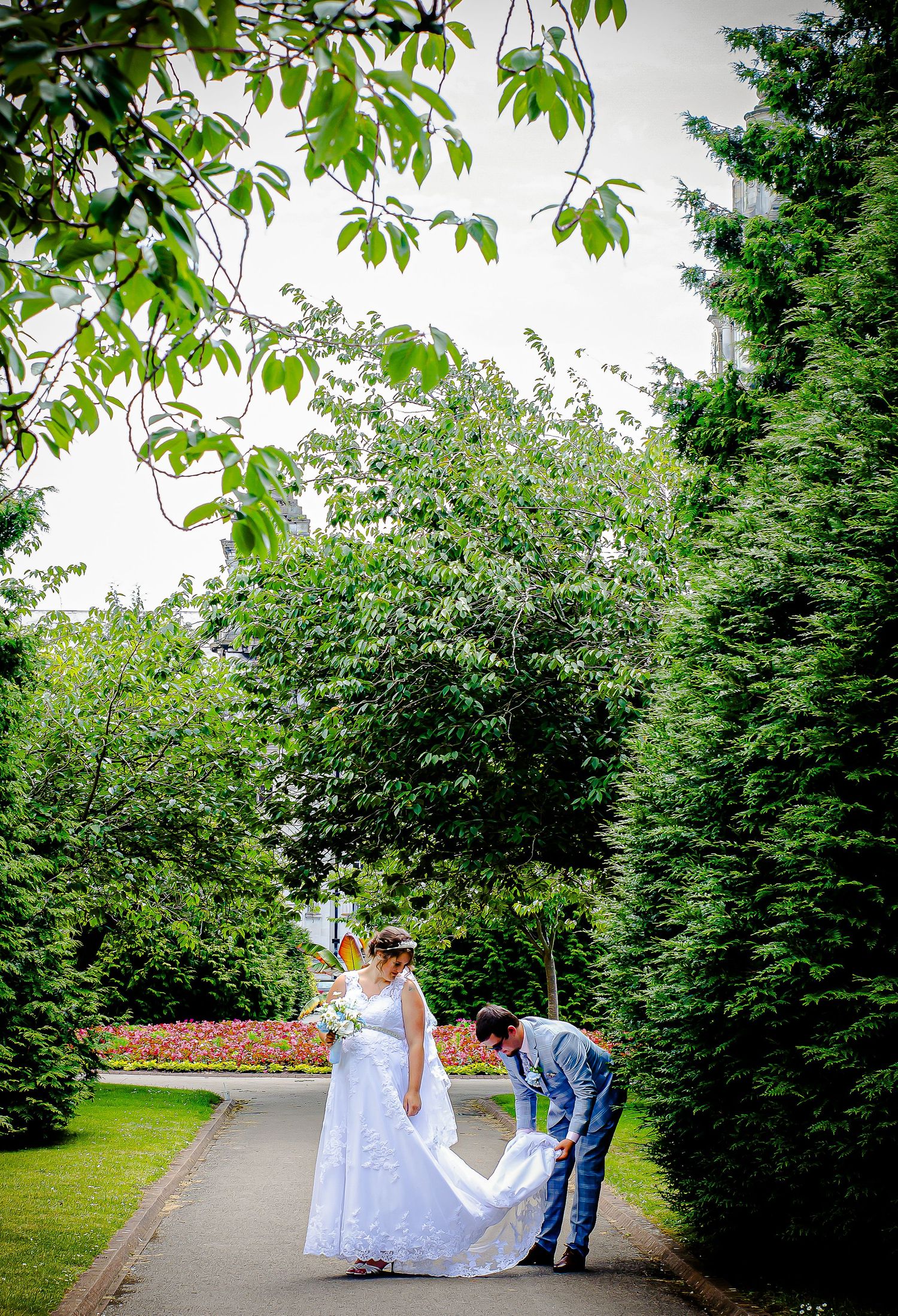 Newlyweds relaxing together among the gardens in Cardiff