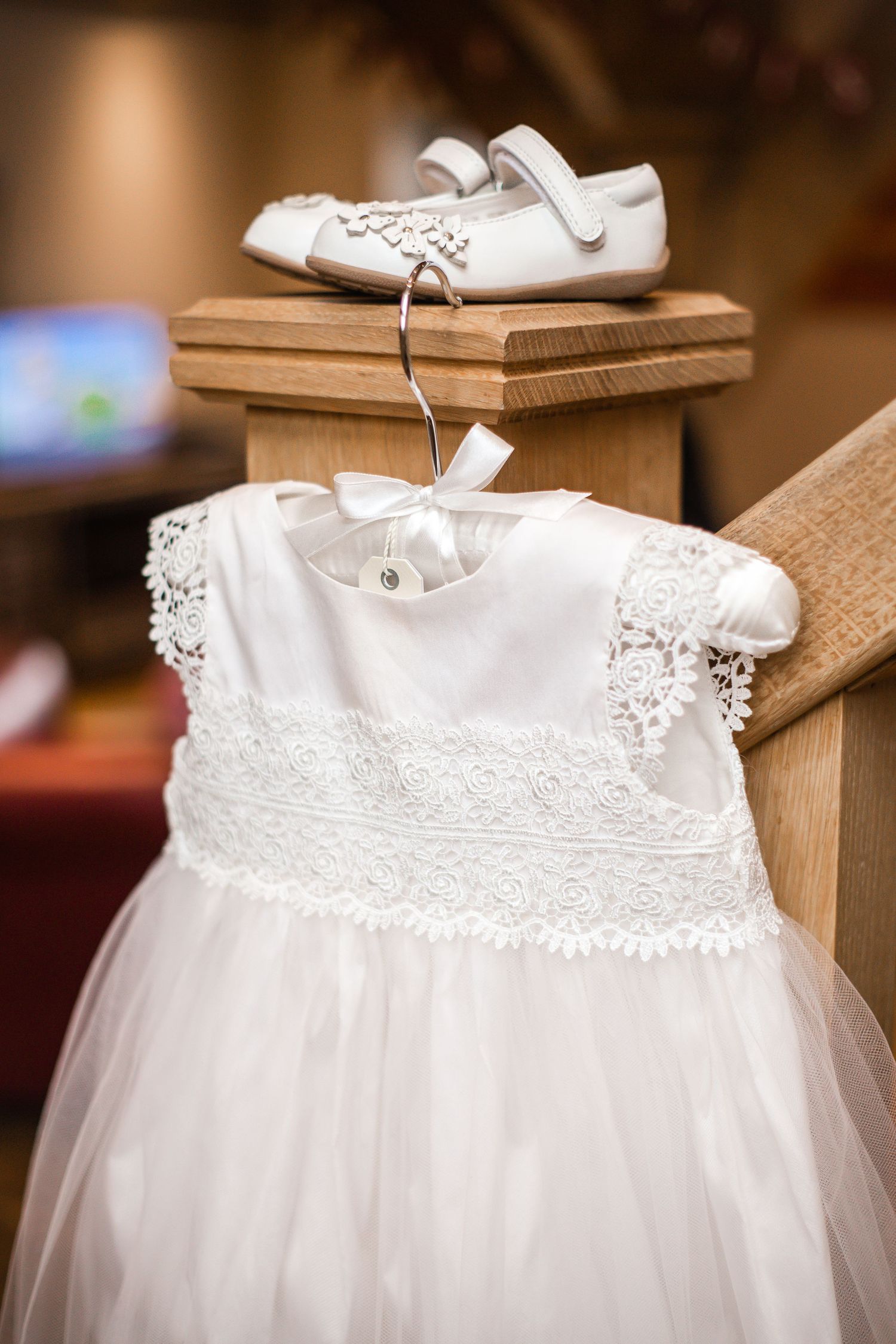 White flower-girl dress and shoes prepared for the wedding