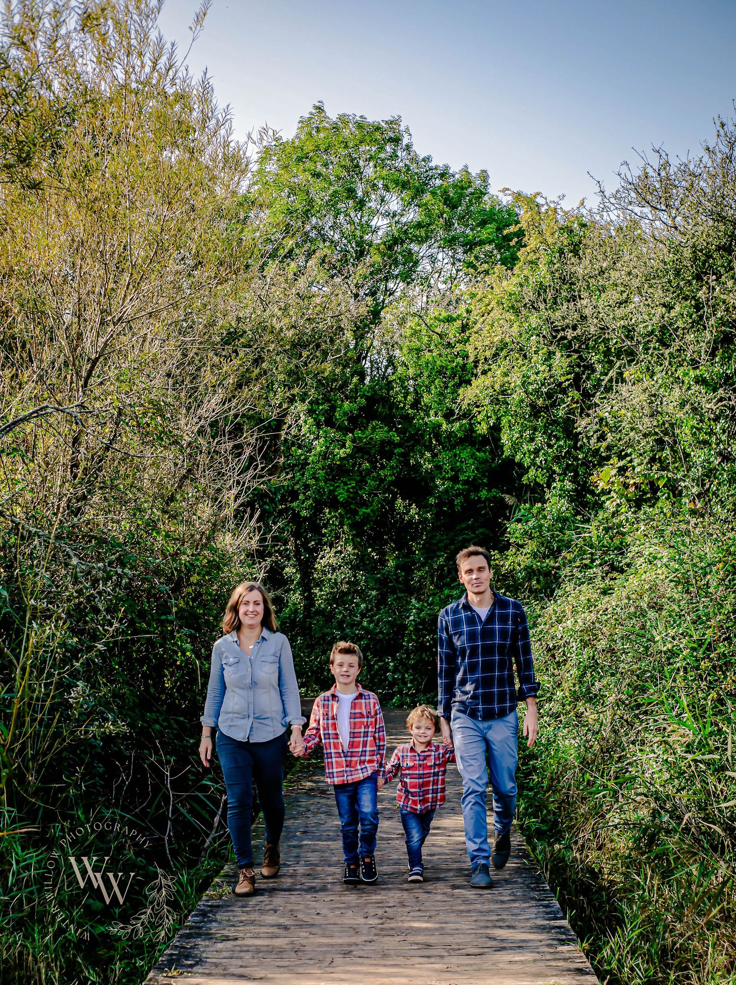 Family walking along a nature trail at Cosmeston Lakes, Penarth
