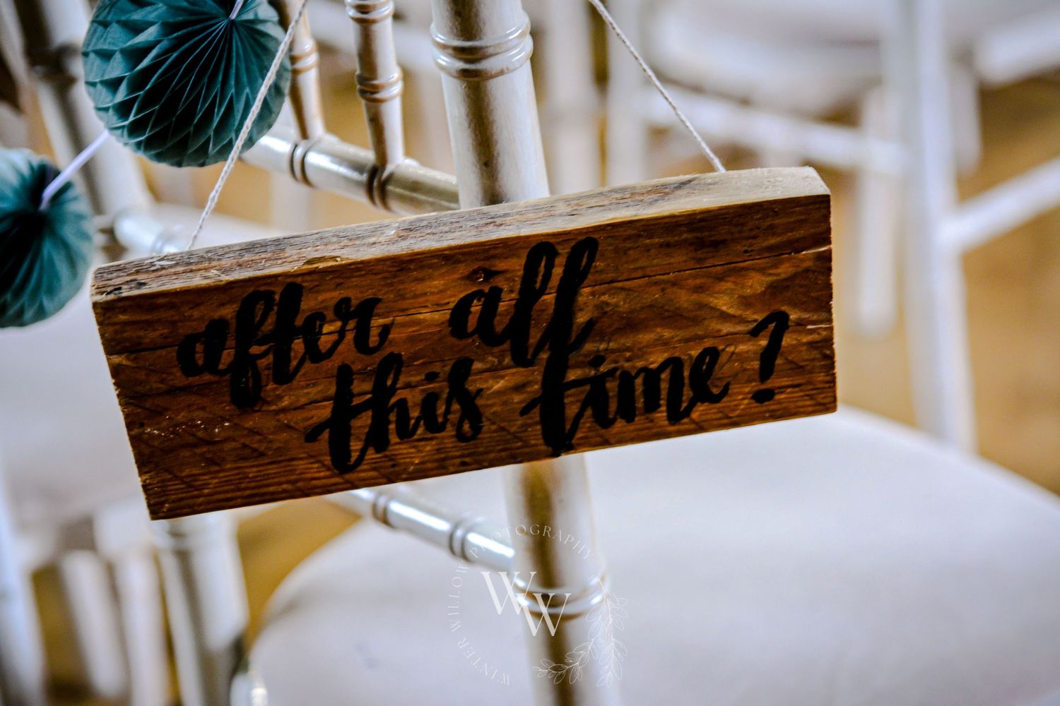 Harry Potter-inspired wooden wedding chair sign reading “after all this time?”