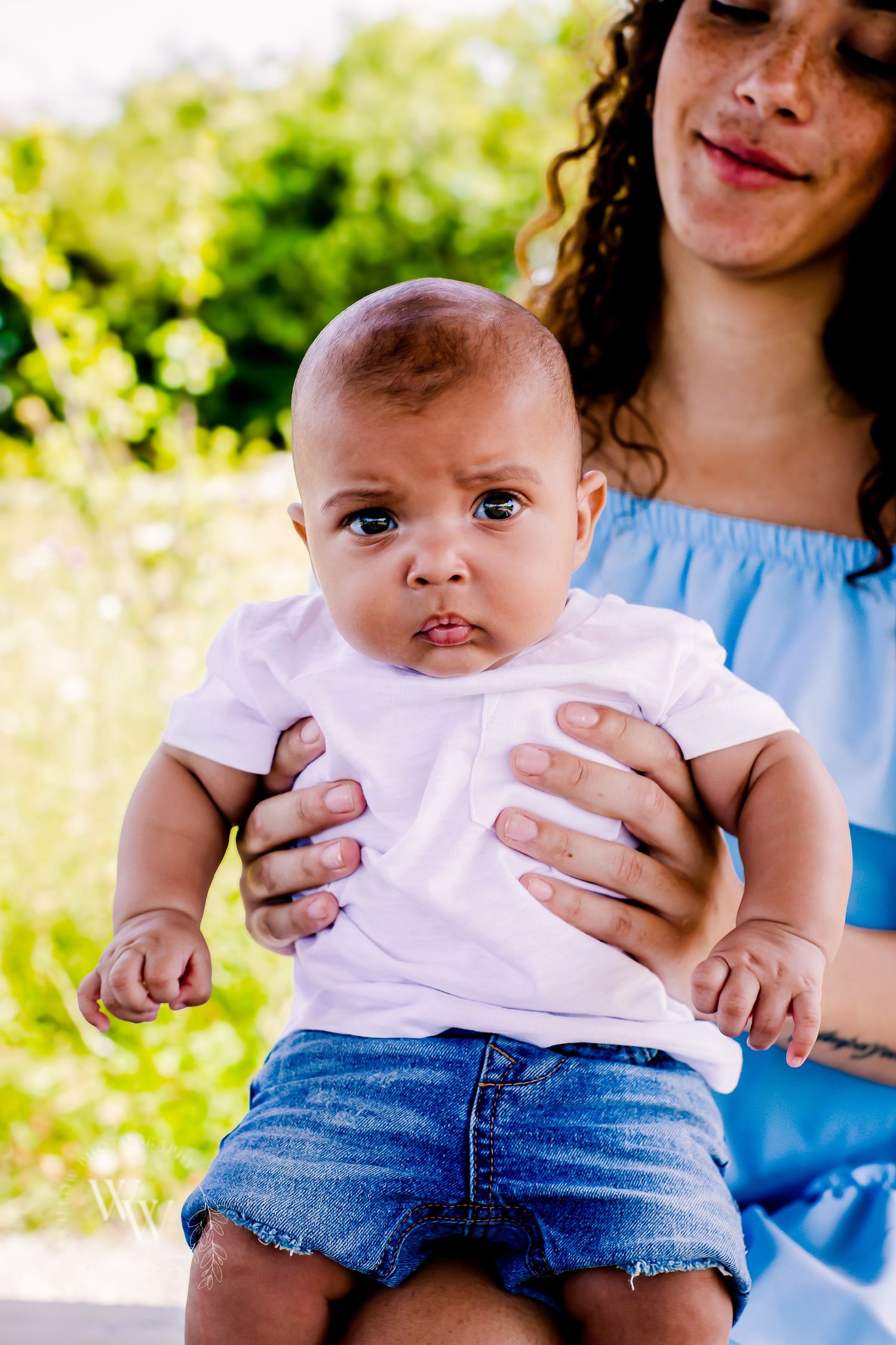 Close-up portrait of a baby during a summer family photoshoot at Cosmeston Lake, Penarth