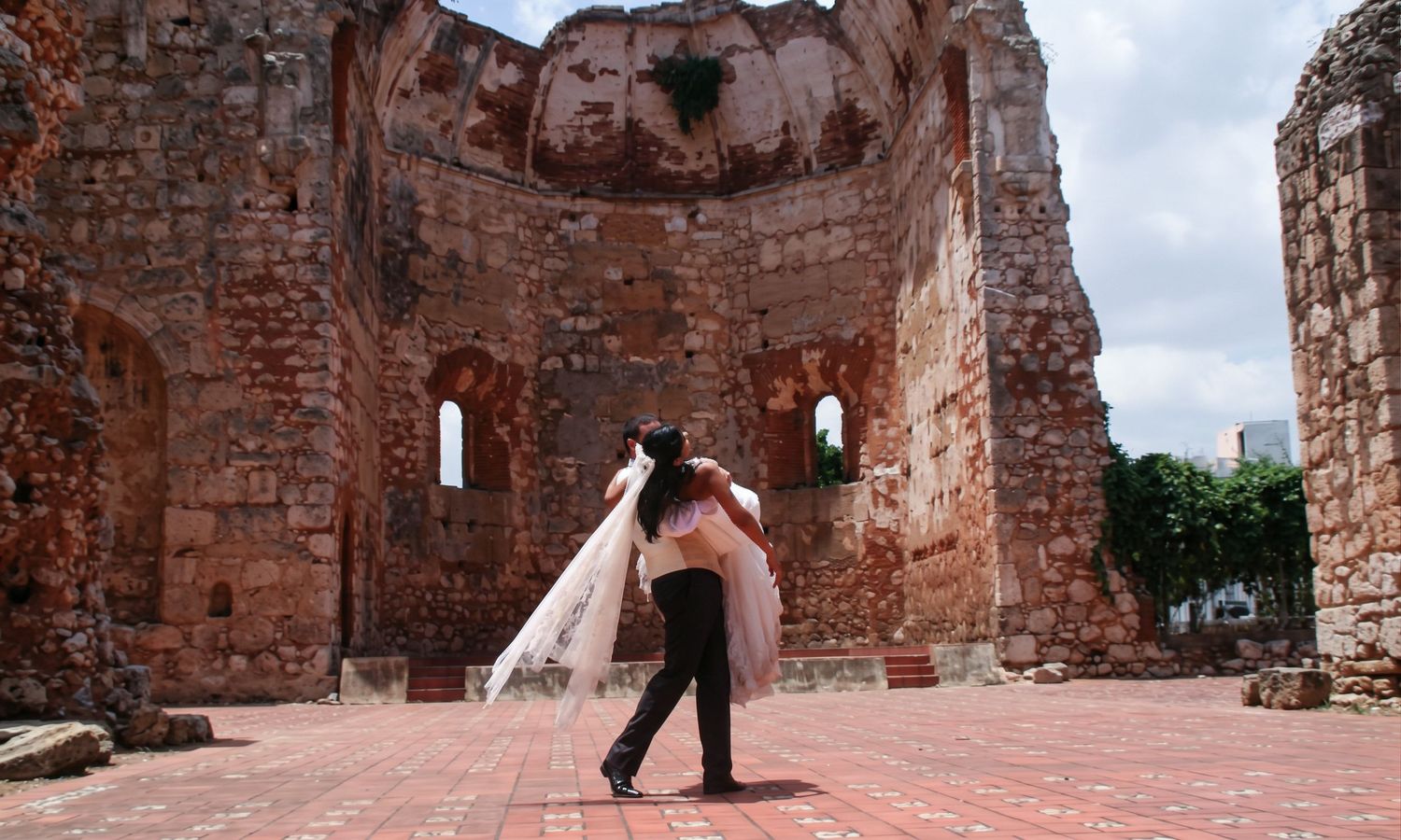 Bride and groom portrait in front of historic architecture ruins - Philadelphia