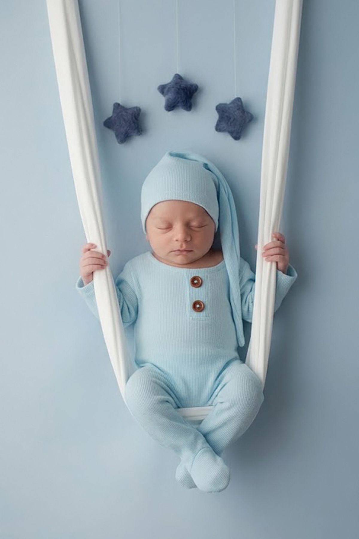 Professional newborn portrait session with custom prop setup in Philadelphia