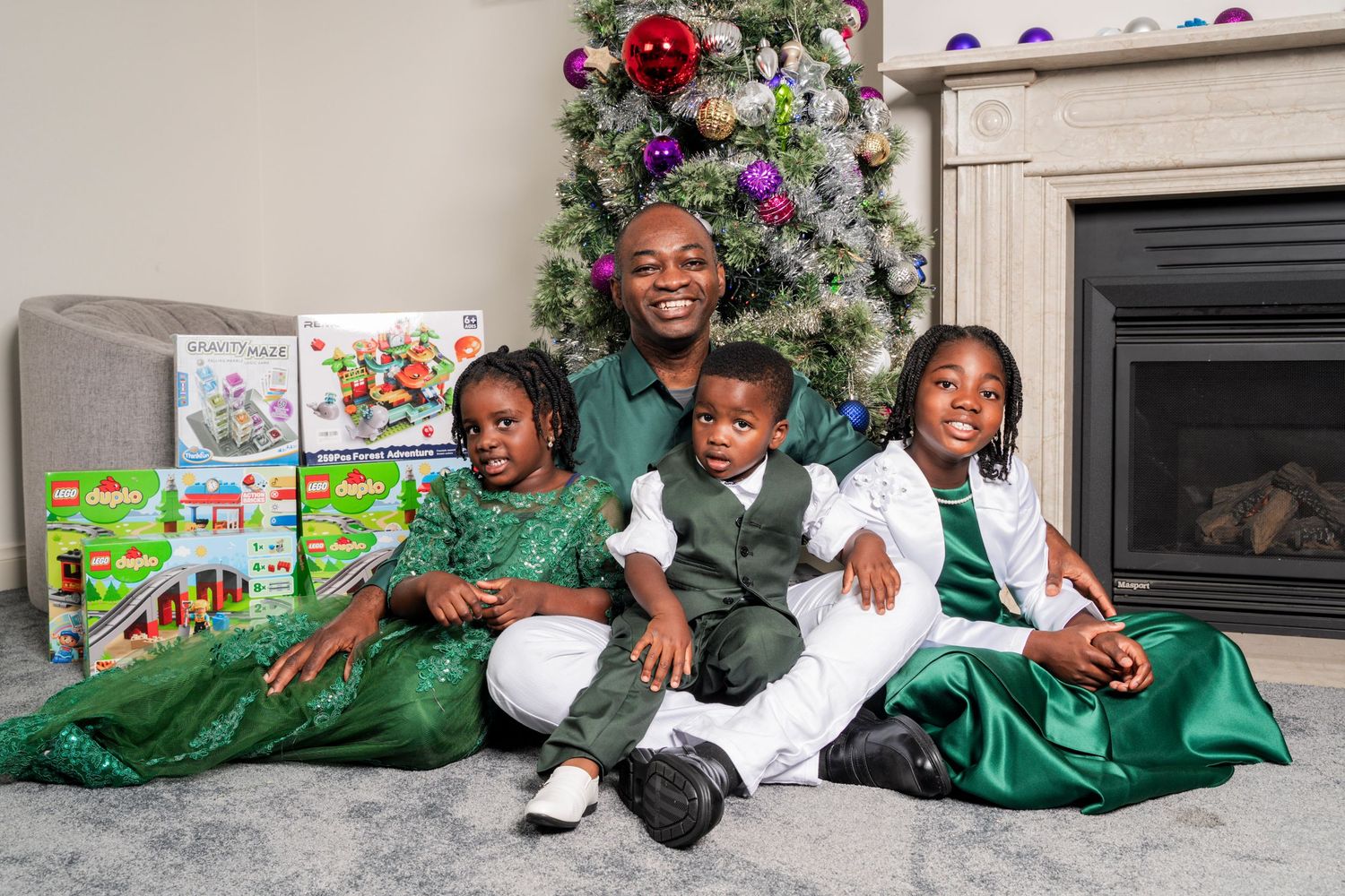 A series of playful holiday portraits showing people in green outfits posing on a doorstep with festive decorations.