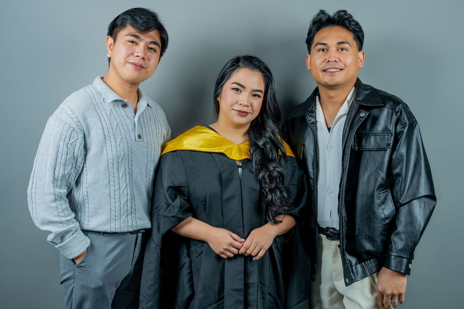 Group photos of people in casual and formal academic attire posing together in a studio setting.