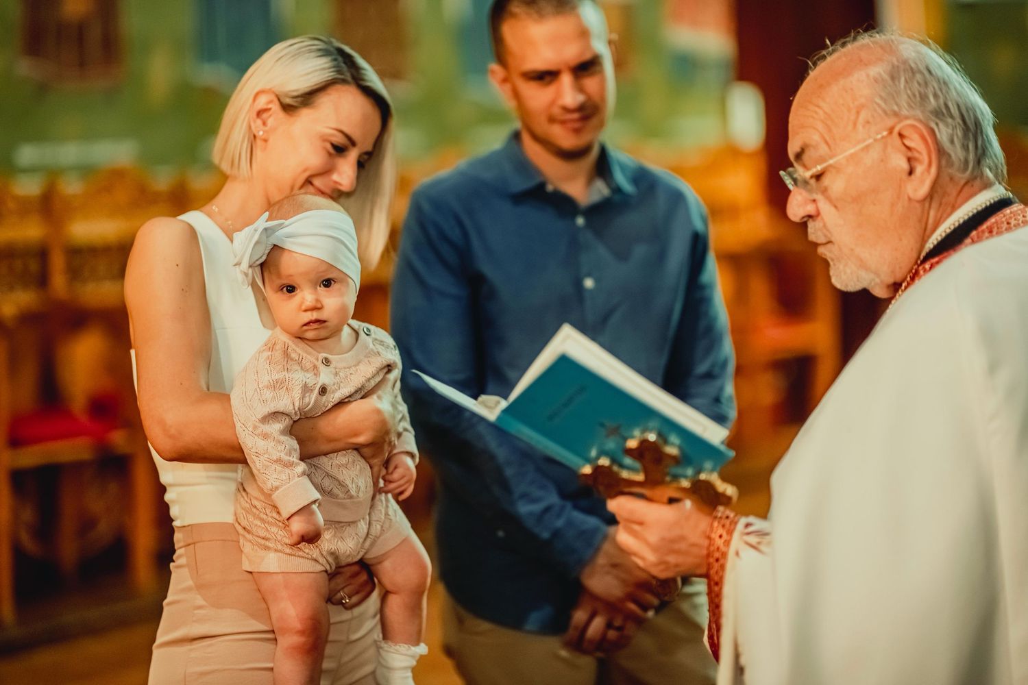 A series of photos showing a baby being baptized in church ceremony while held by adults.