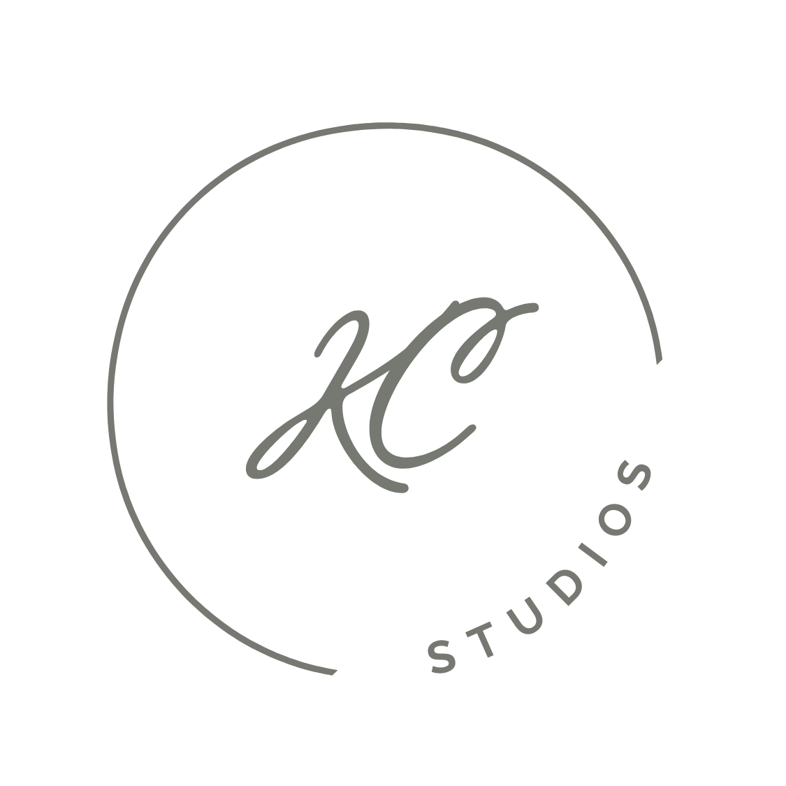 Minimalist logo design featuring 'KC Studios' text in a circular frame with gray typography on black background.
