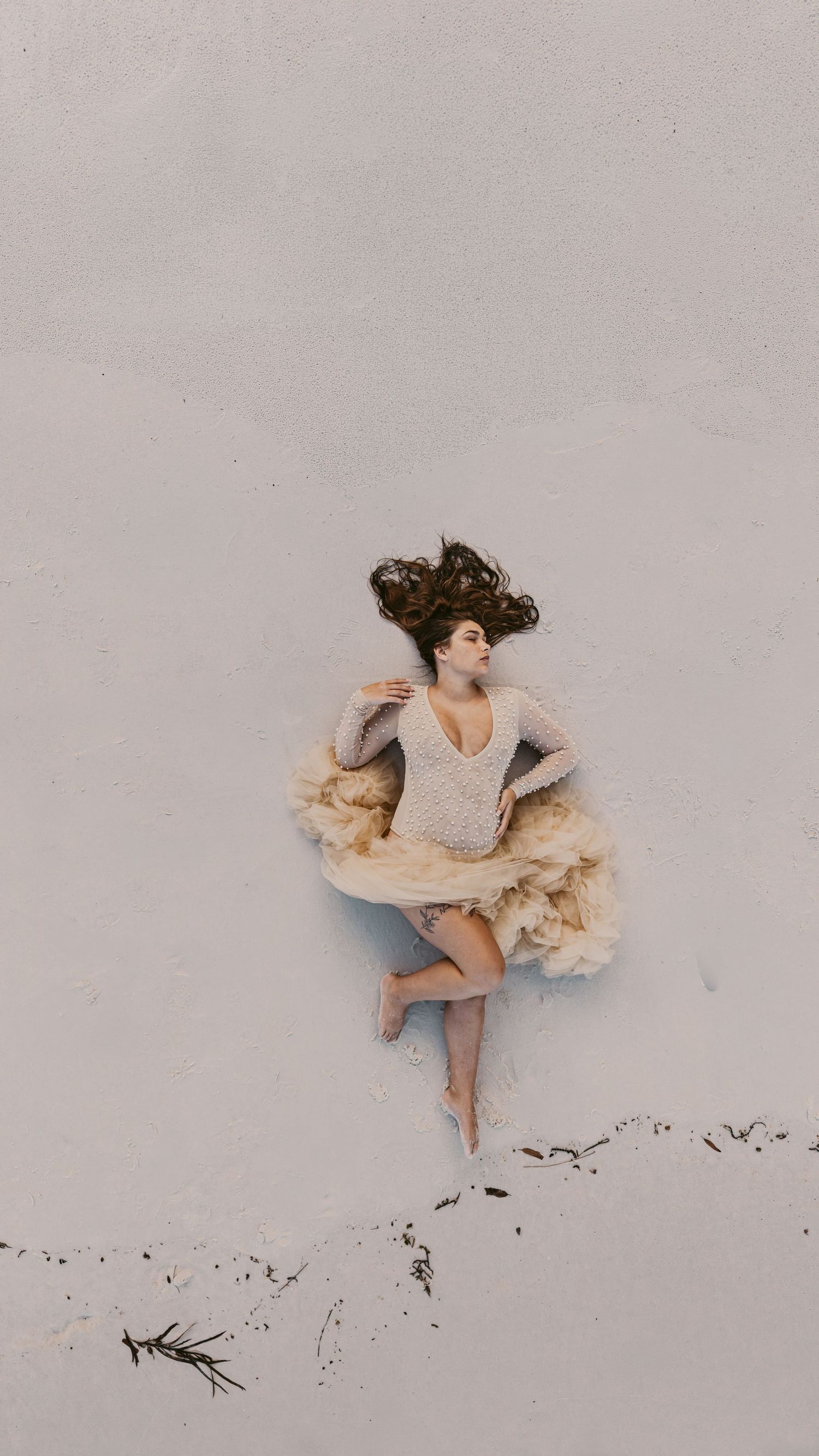 aerial-drone-maternity-photo-pregnant-women-laying-on-white-sands-jervis-bay-greenfields-beach-jervis-bay