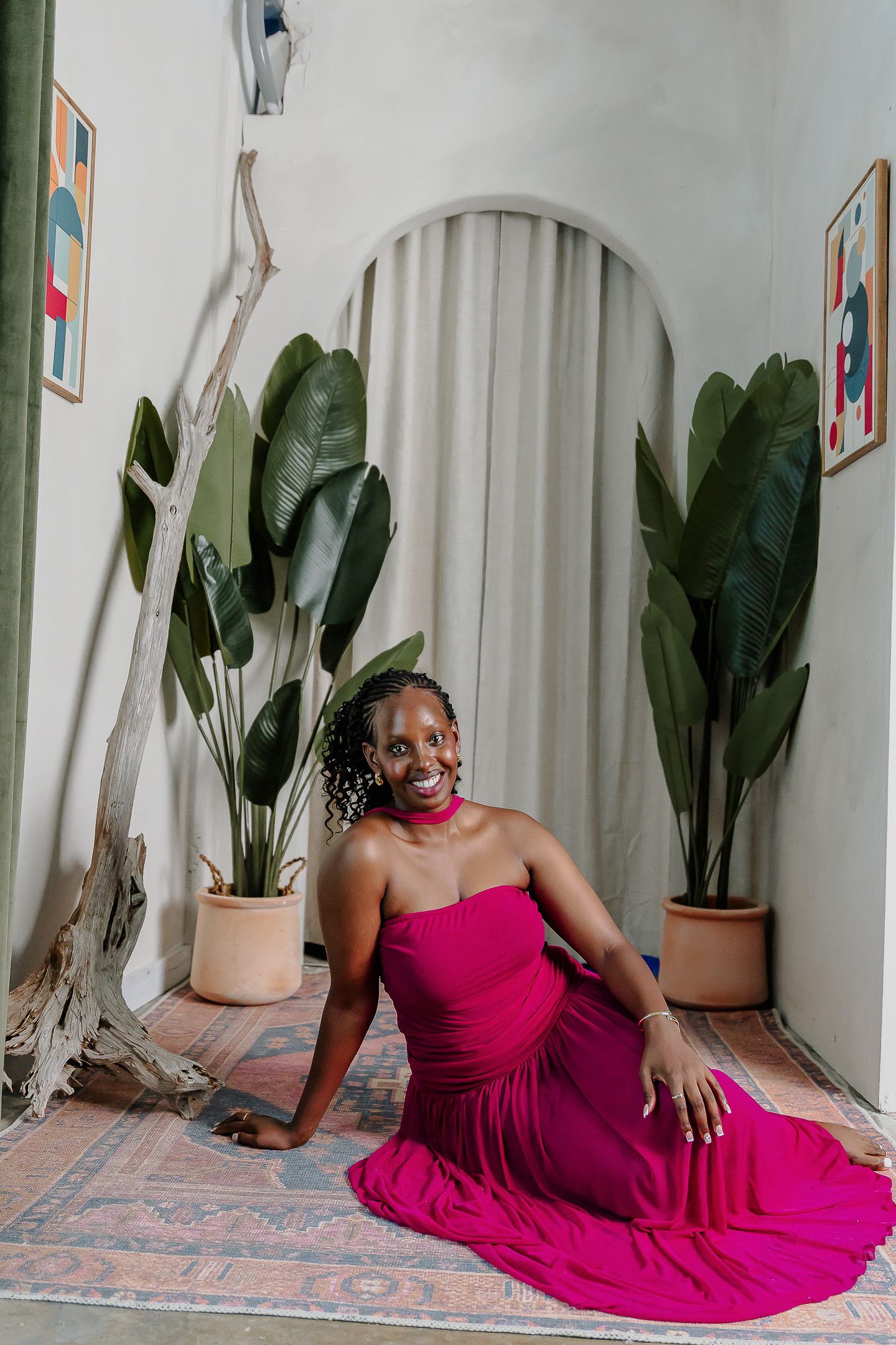 Four sequential photos show a person in a vibrant magenta dress posing gracefully on a tiled floor near potted plants.