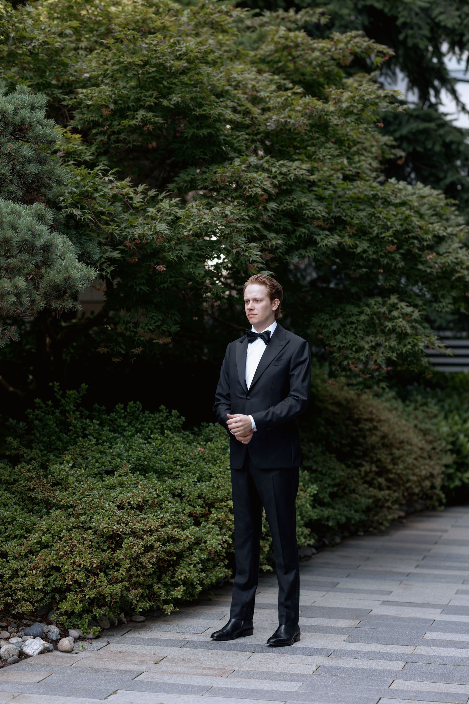 The groom is waiting for first look with a bride at Marriott Hotel in Vancouver