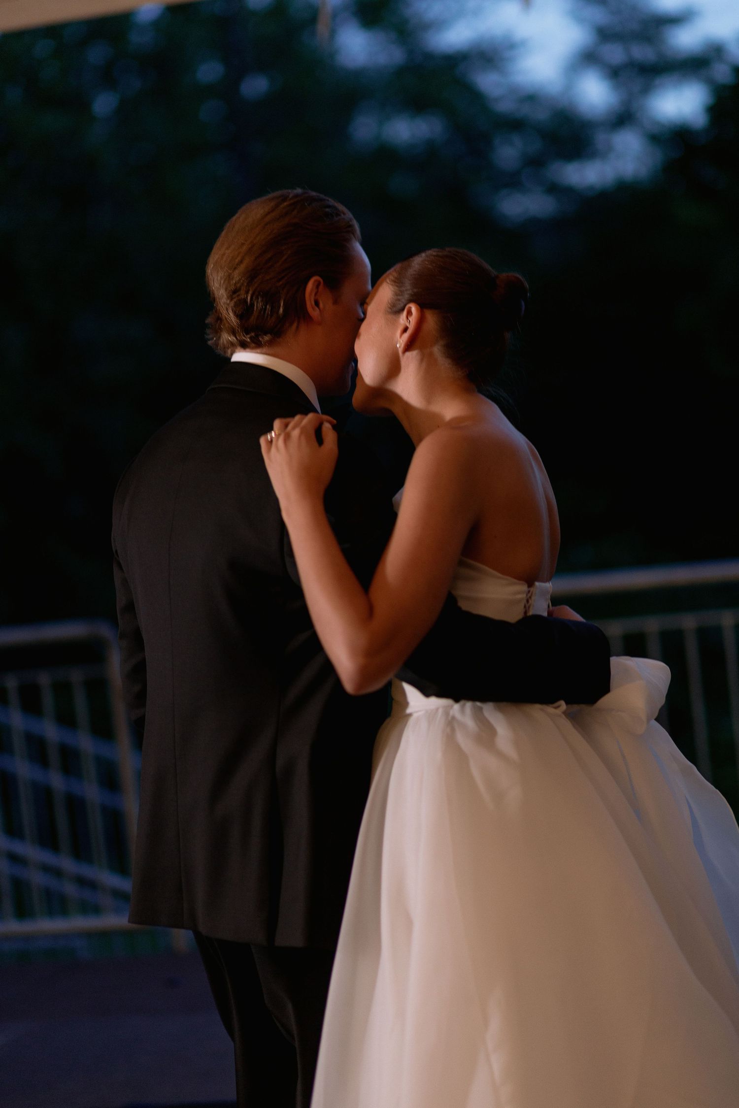 Silhouette of a couple sharing an intimate moment during their first dance.