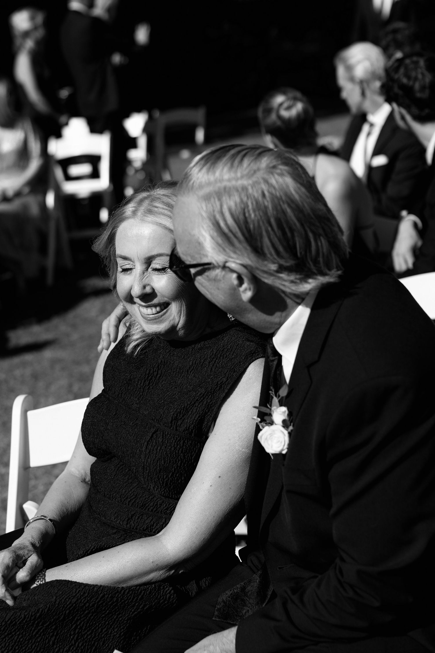 A romantic black and white sequence showing a couple in formal attire sharing intimate moments together.