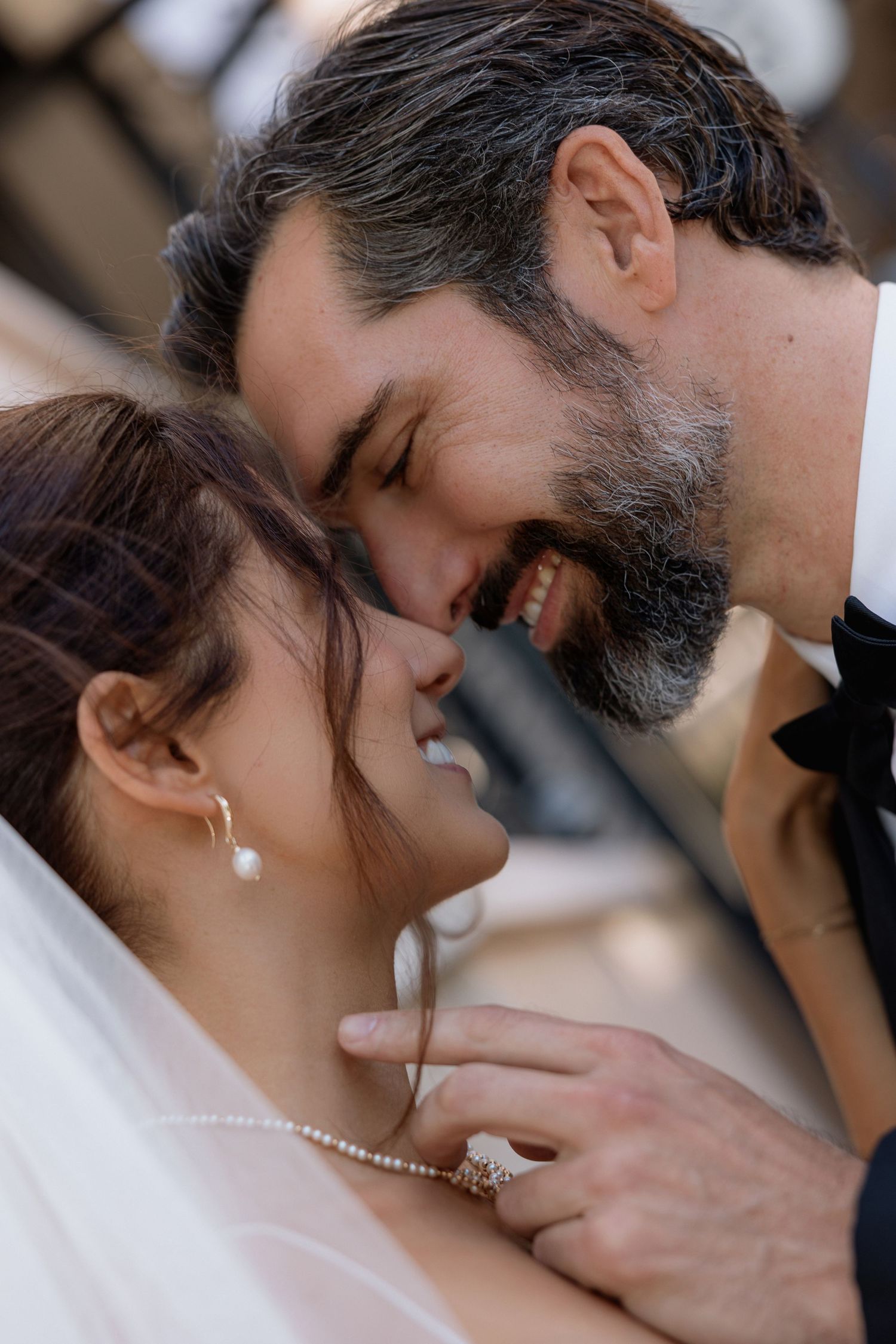 Romantic close-up of a tender moment between newlyweds.