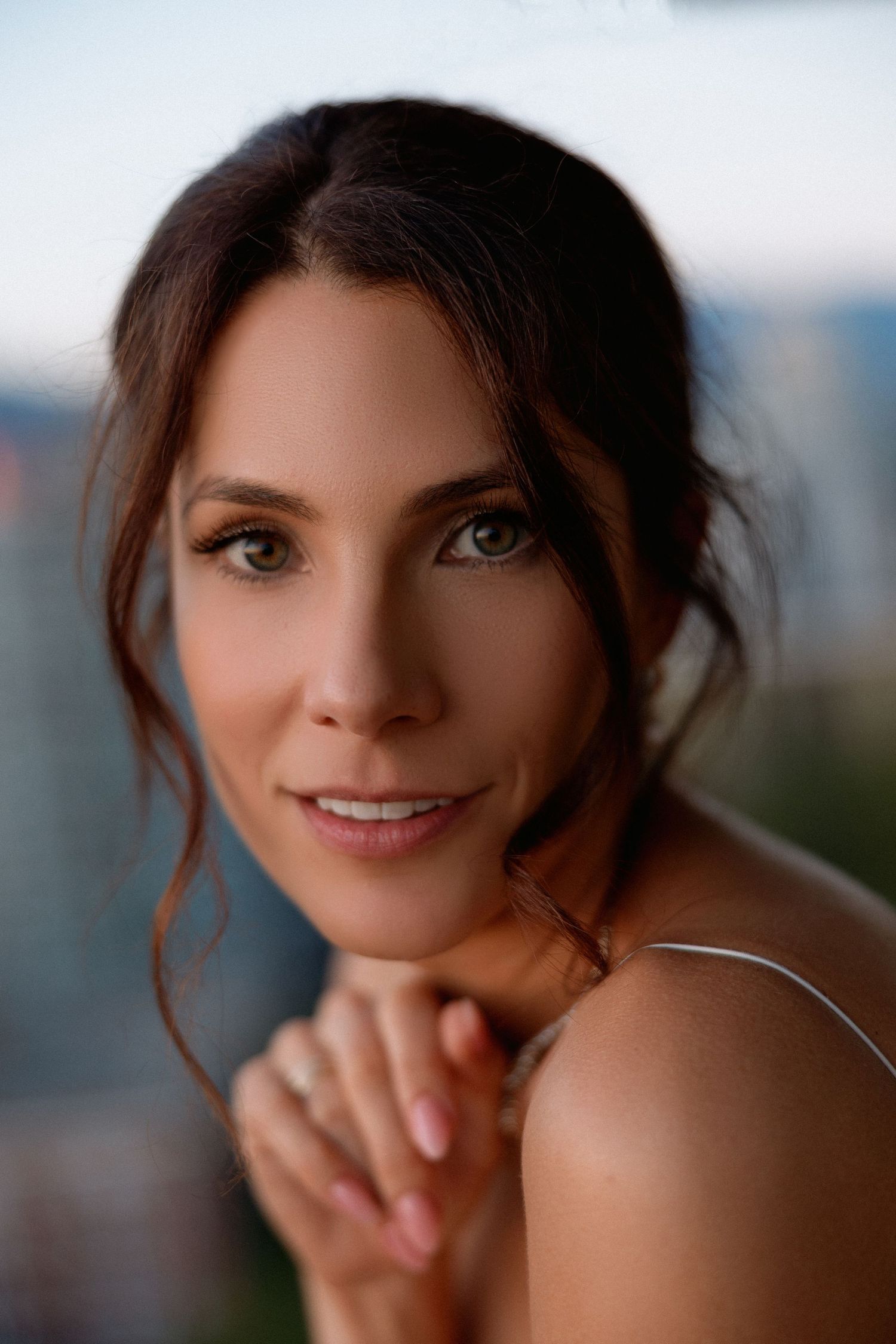 Close-up portrait series showing a woman's playful expressions and smiles.