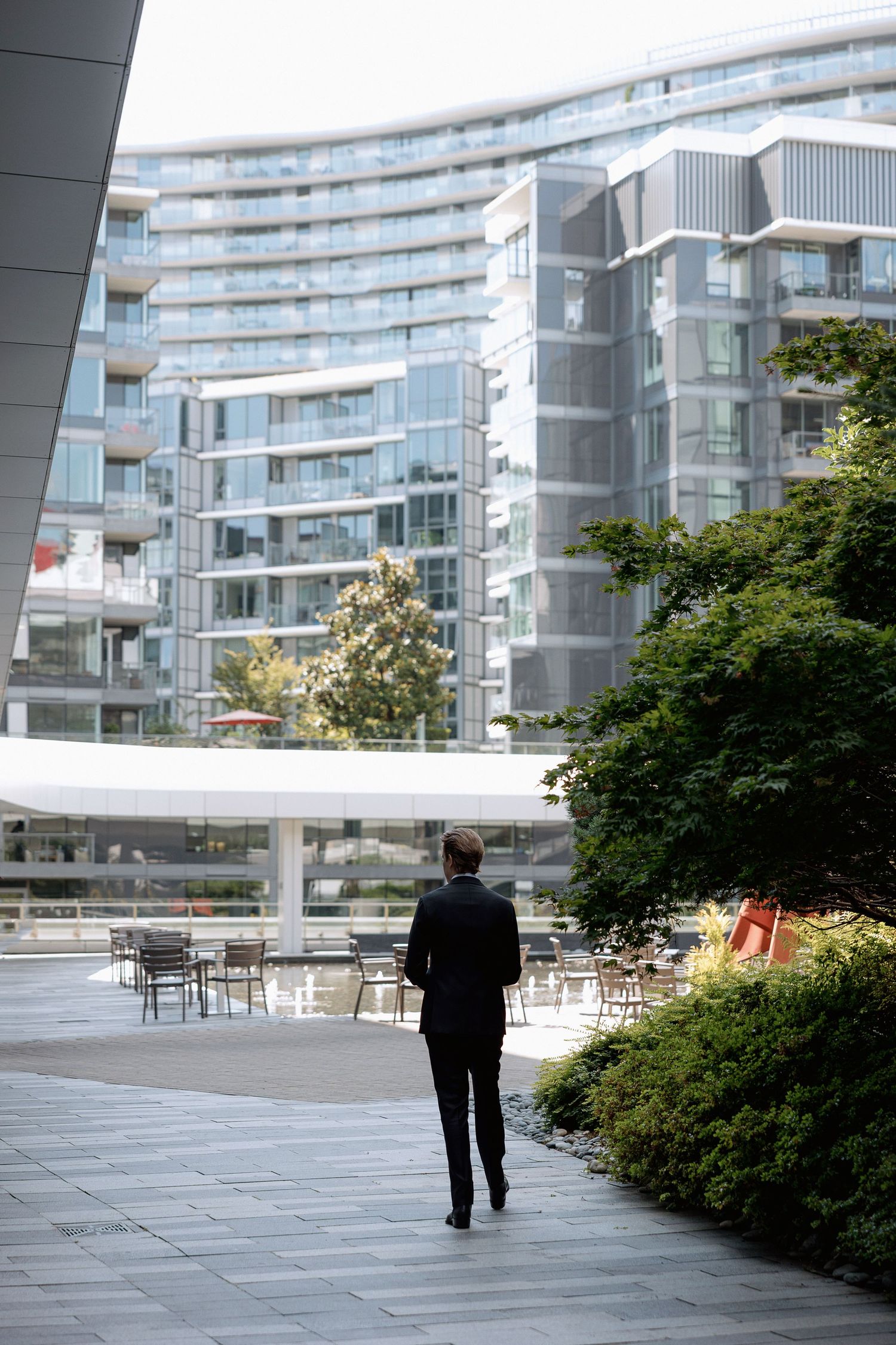 The groom is waiting for first look with a bride at Marriott Hotel in Vancouver