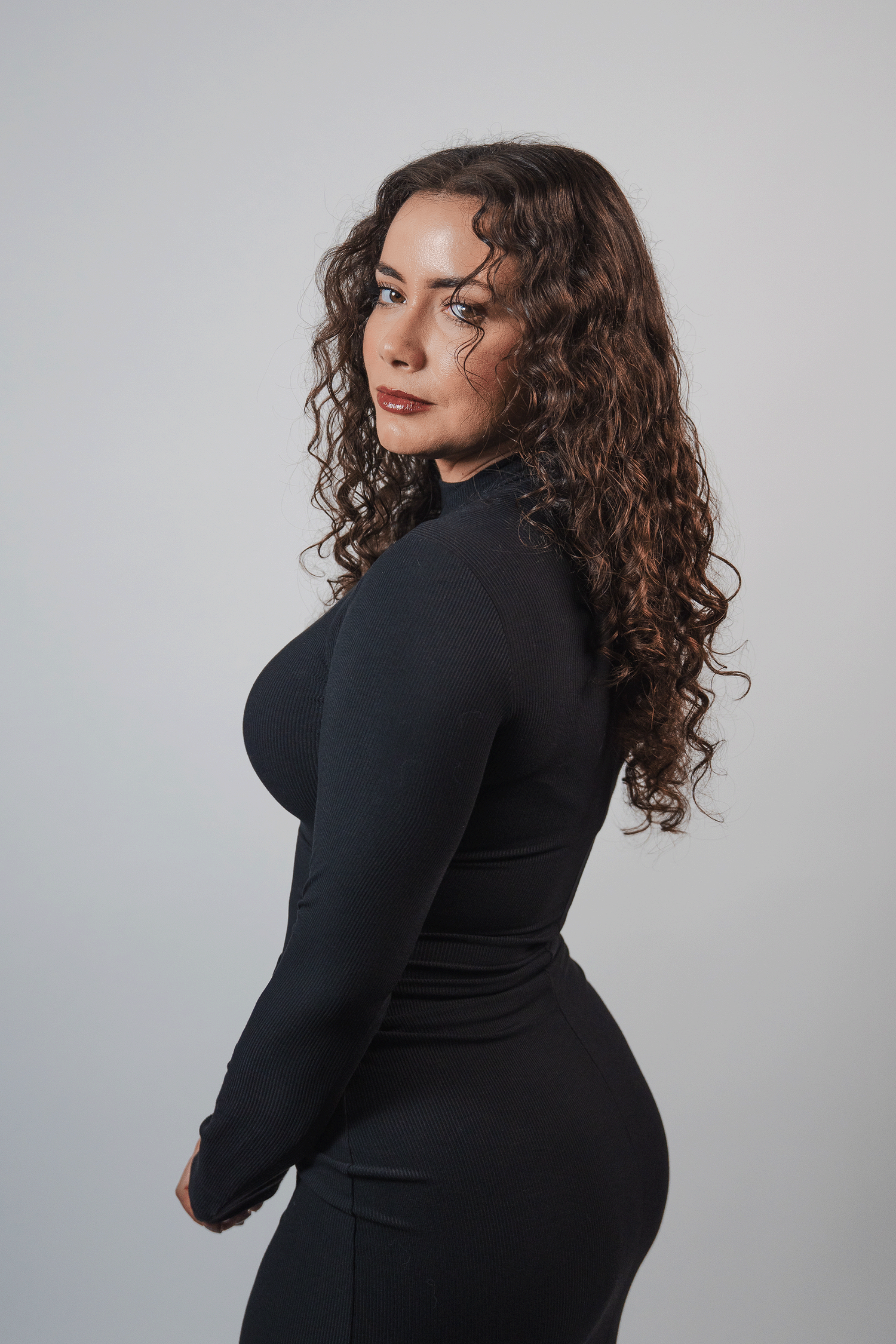 Studio portrait by South Florida photographer, clean headshot of woman with natural glam lighting for personal branding