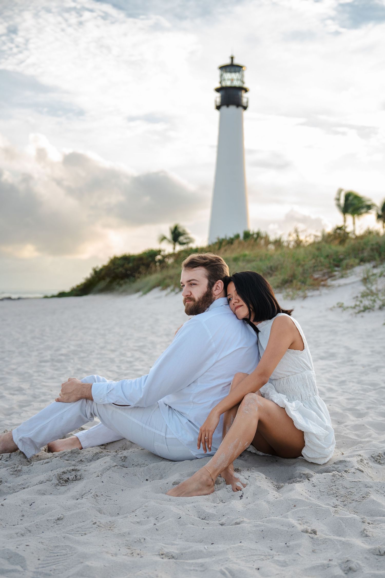 Engagement photos at Bill Baggs State Park in Key Biscayne by South Florida photographer, couple on beach with lighthouse