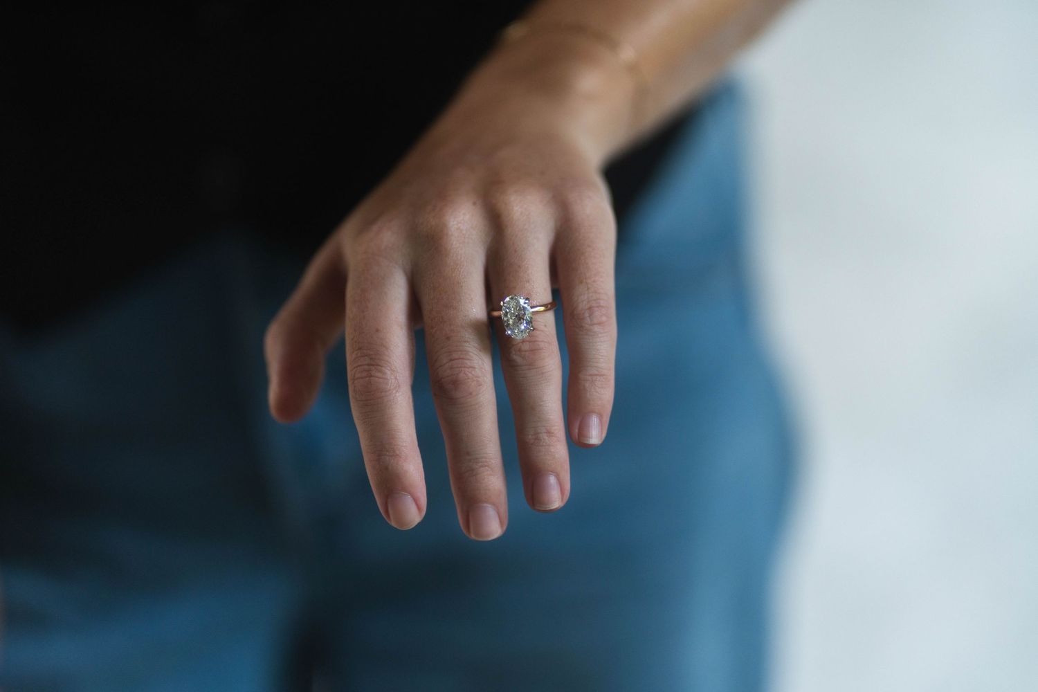 Elegant close-up of a diamond engagement ring, capturing the joy of a surprise proposal at The Kampong in Miami, FL.