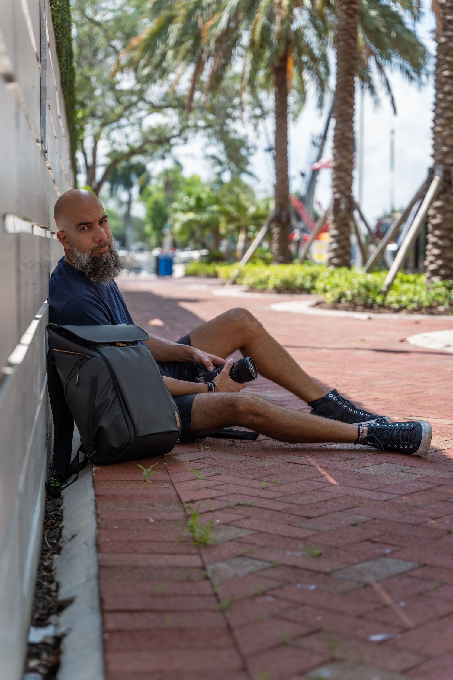 Casual lifestyle session in Fort Lauderdale, FL – relaxed city portrait of a man leaning against a wall.
