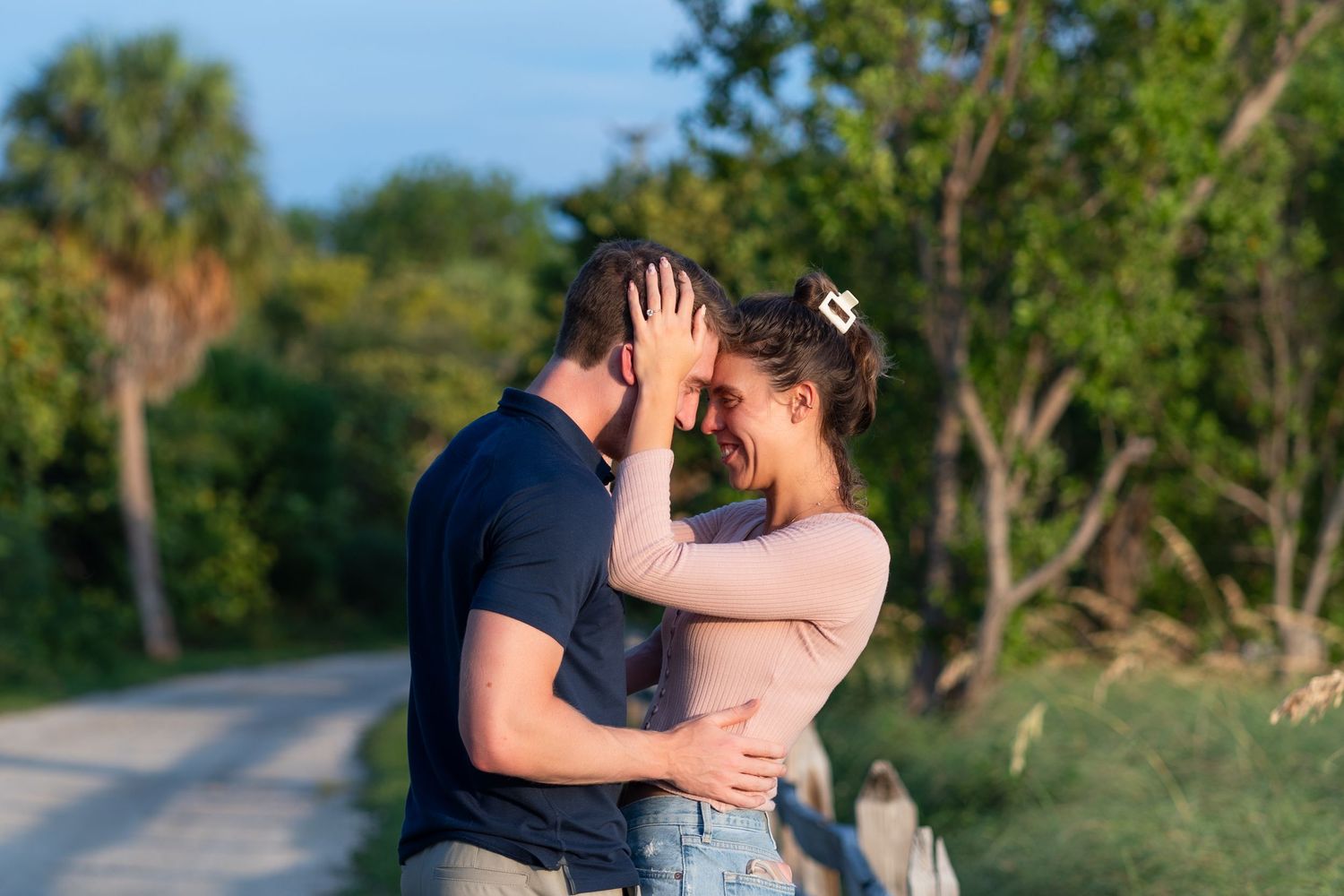 Romantic proposal photo of a couple embracing during an engagement session at Key Biscayne, Florida.