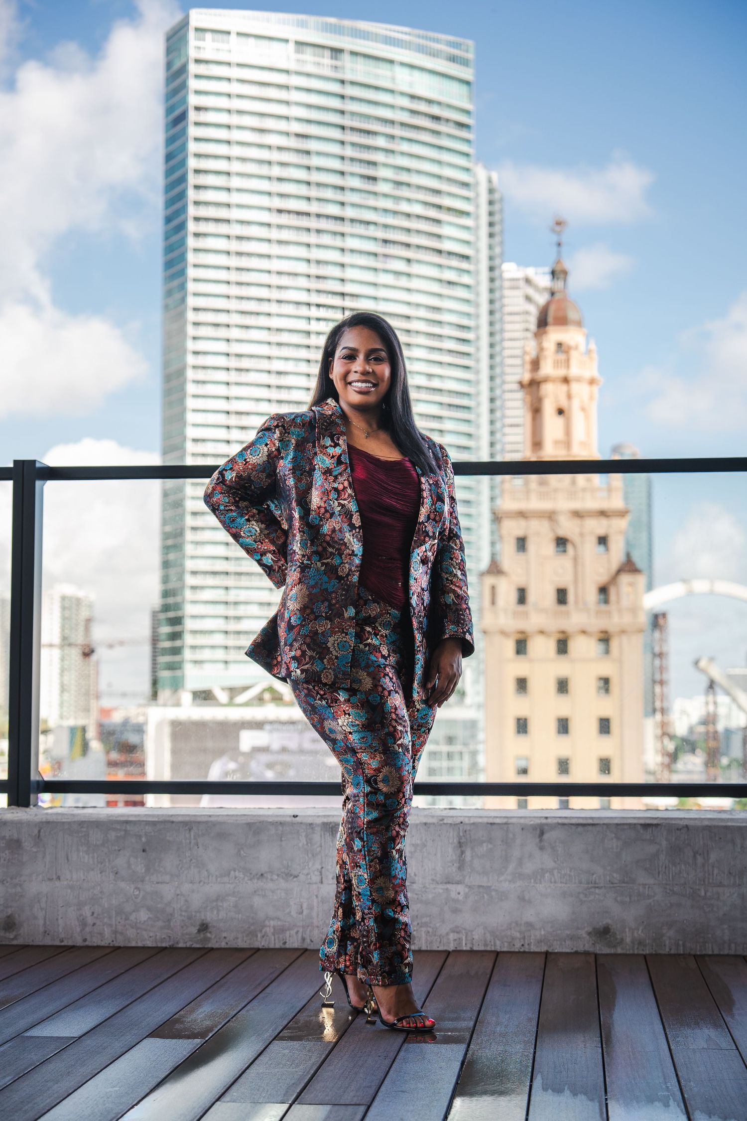 Urban entrepreneur branding photo of a scholarship coach with a city skyline backdrop in South Florida.