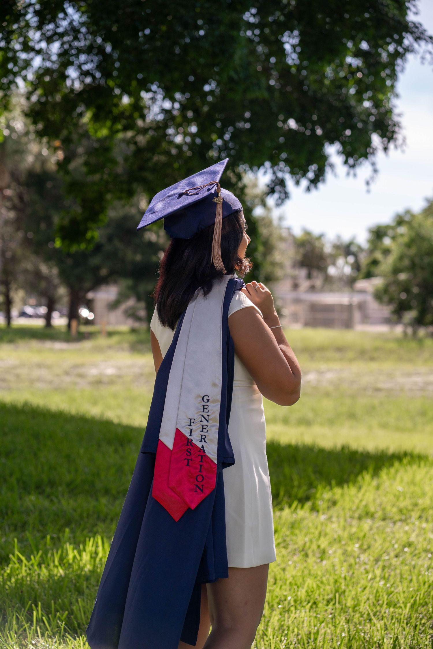 South Florida graduation photography of FAU student posing in cap and gown