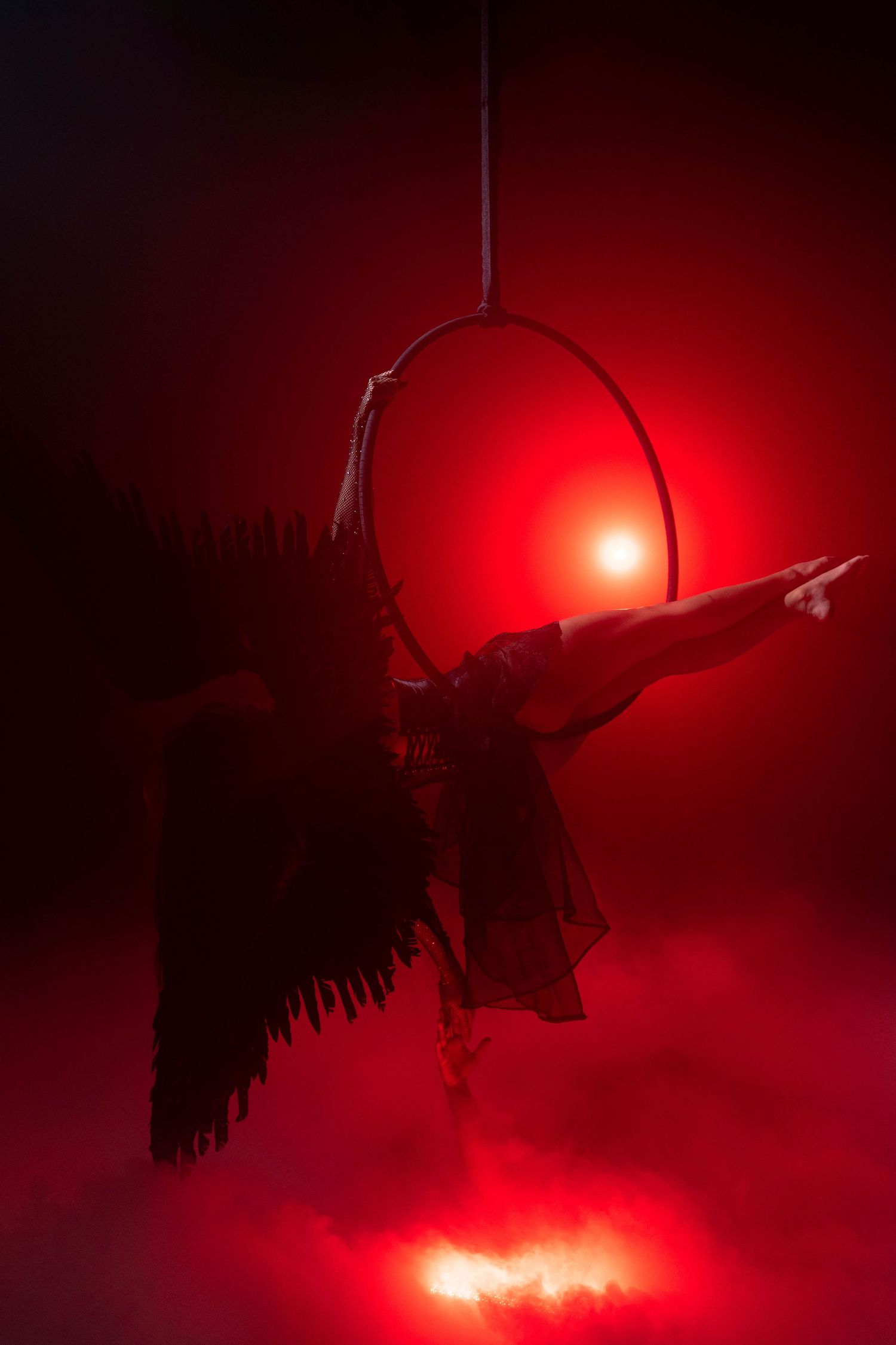 Cinematic fantasy shoot at CFX Studio, Miami, FL – angelic figure reaching toward the light in a theatrical atmosphere.