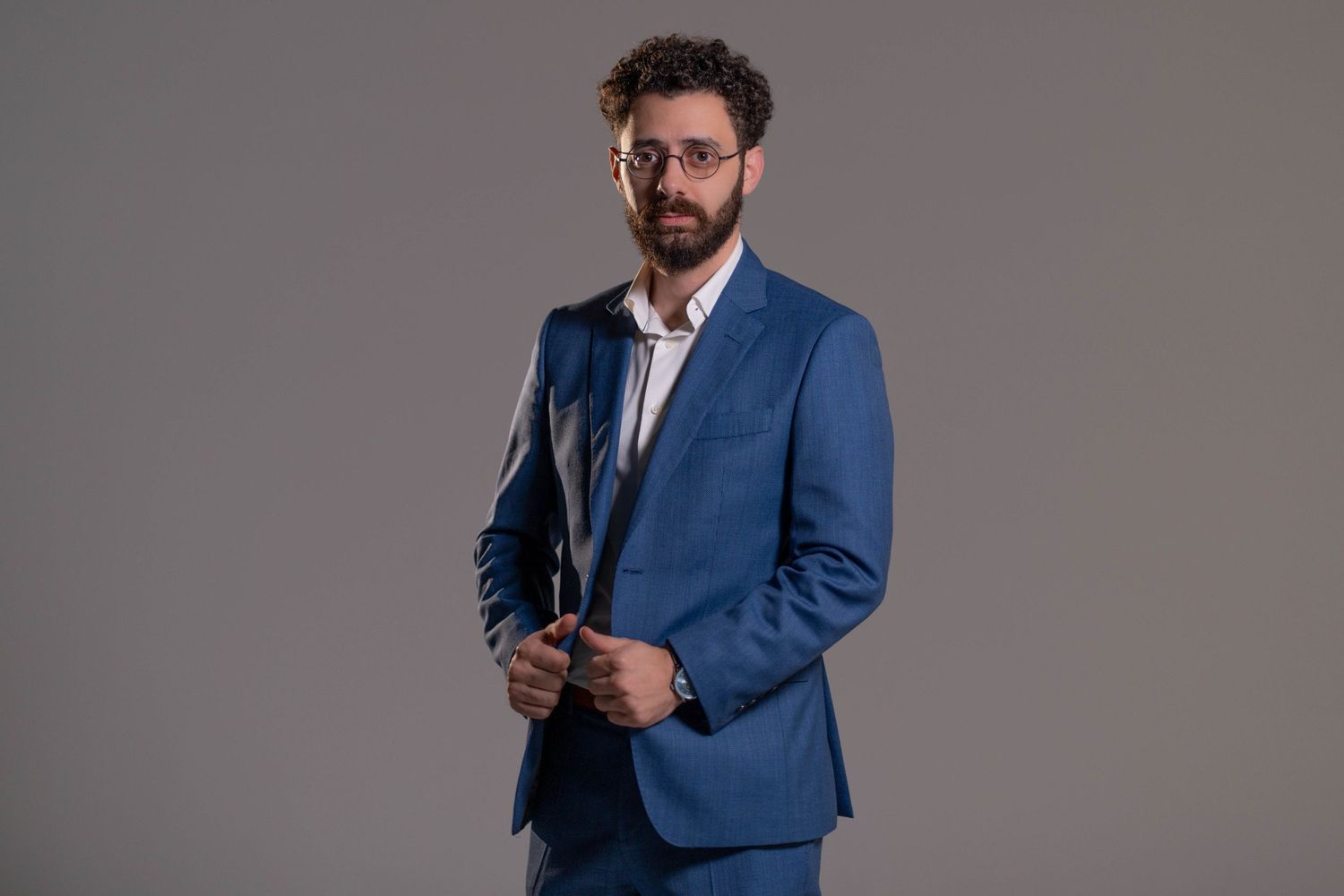 Professional business portrait in Boca Raton, FL – sharp-dressed entrepreneur in a blue suit posing confidently.