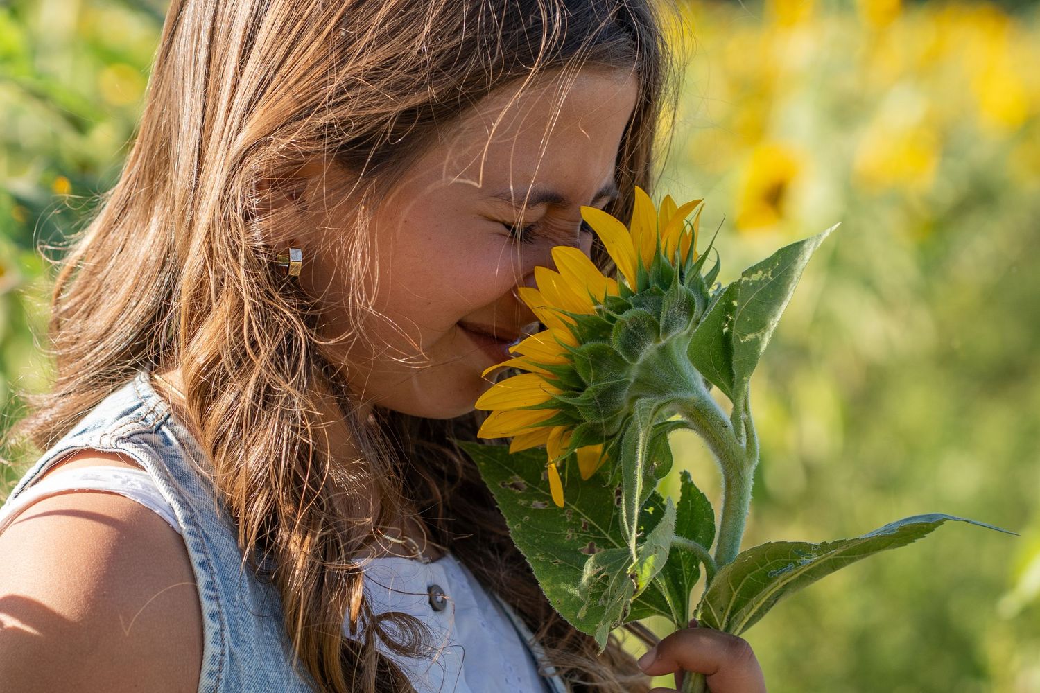 Close-up with a sunflower at Berry Farms during a South Florida birthday shoot.