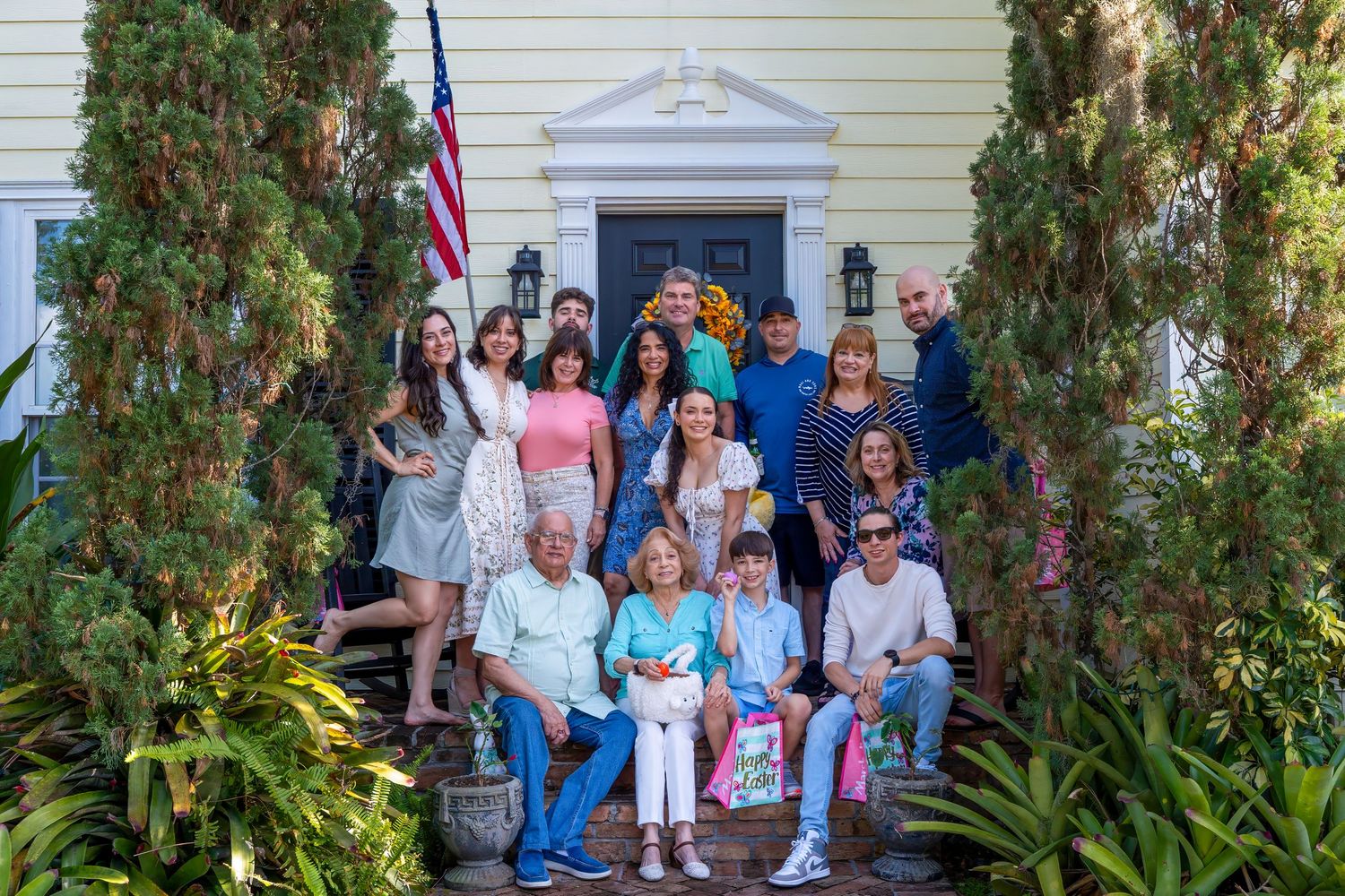 Large family group portrait gathered outside for Easter, joyful and candid lifestyle photography in South Florida. West Palm Beach