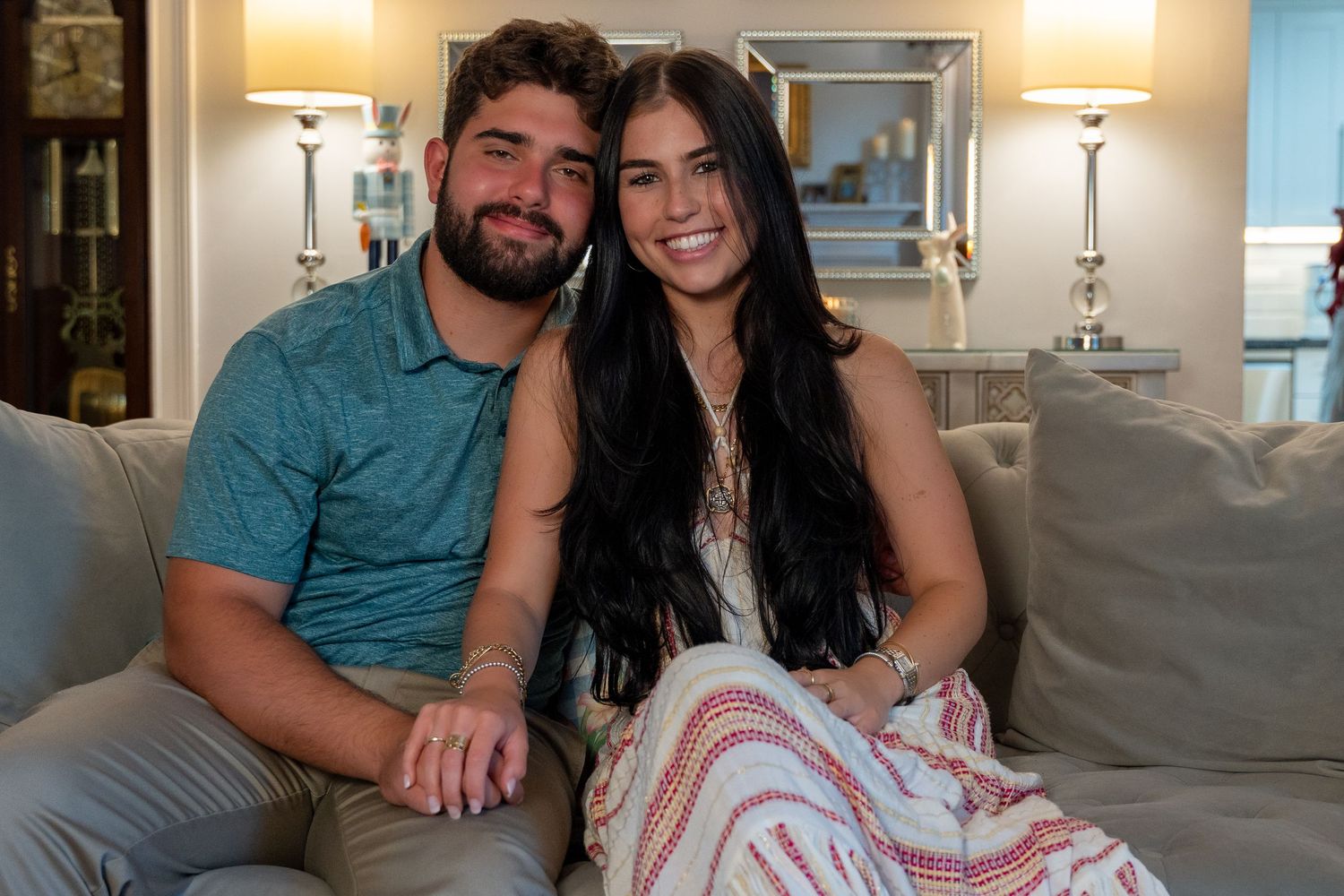 Relaxed couple’s portrait in a warm, inviting home setting, capturing love and connection in a natural way.