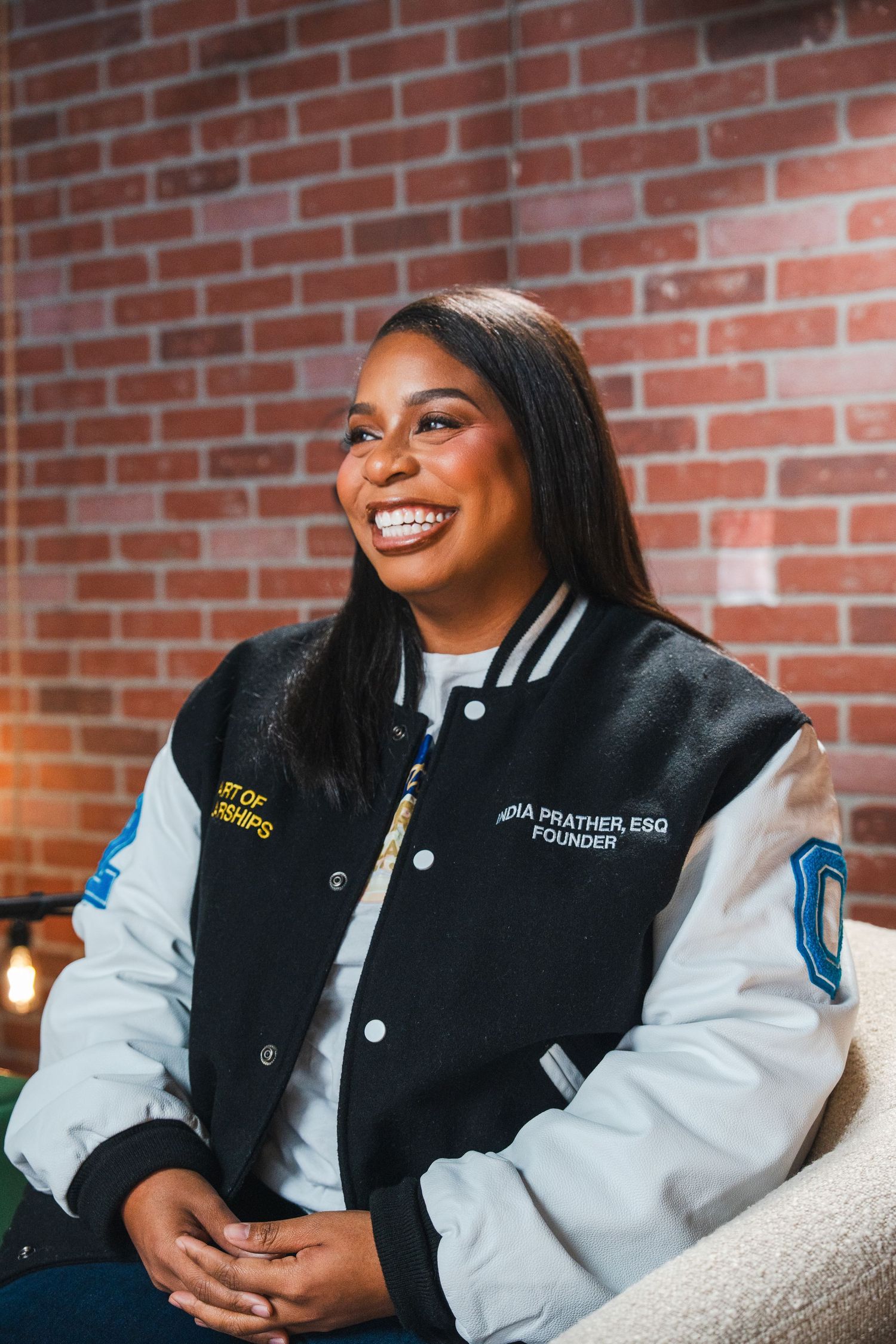 Personal brand photography of a scholarship coach laughing naturally during an entrepreneur branding shoot.