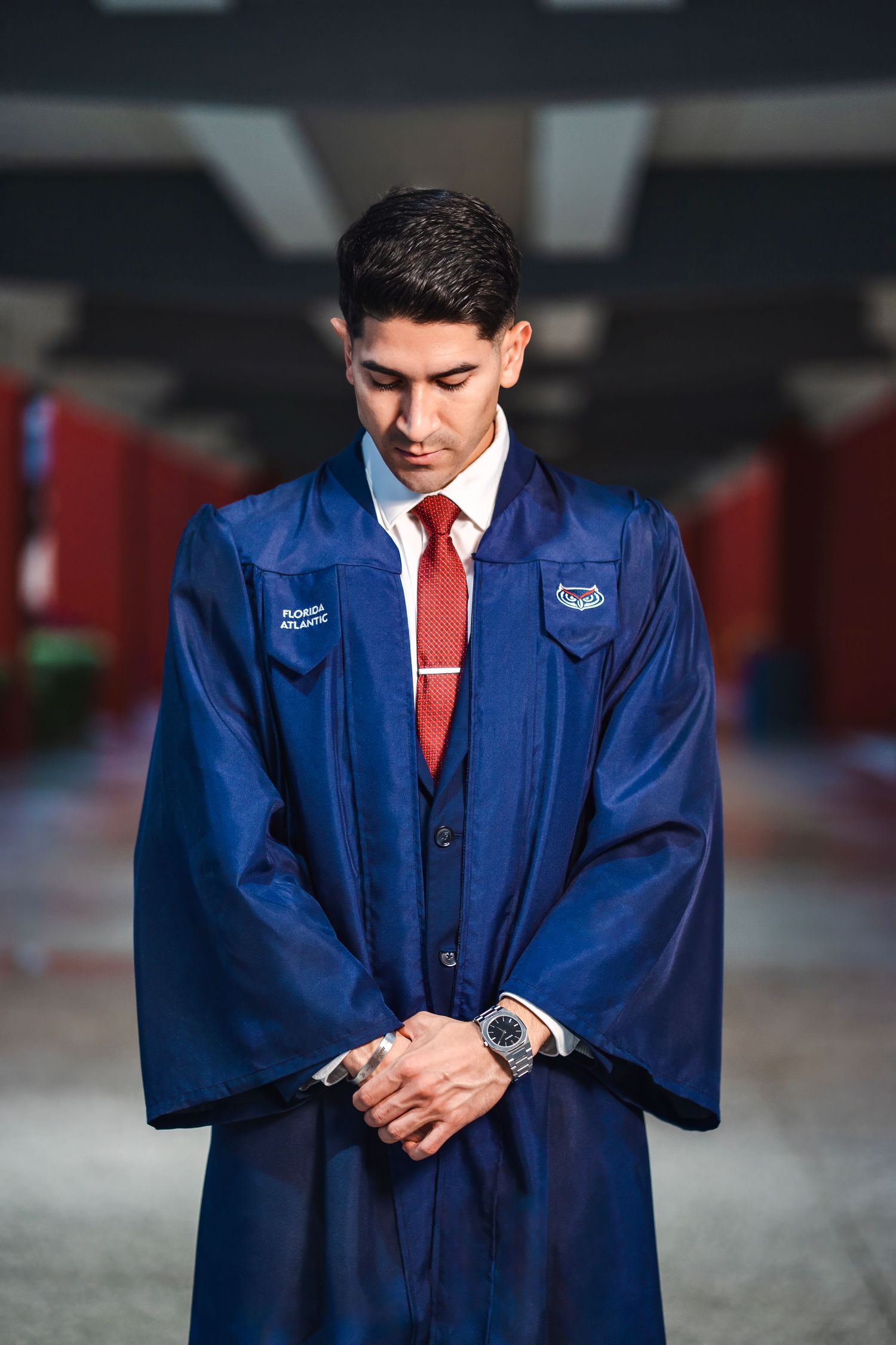 Close-up graduation portrait of an FAU graduate in cap and gown during a Boca Raton senior session.
Graduation portrait of an FAU student ad