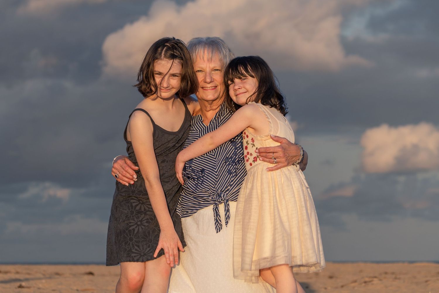 Grandmother with grandchildren in Palm Beach, FL – warm family moments captured on a breezy evening by the ocean.